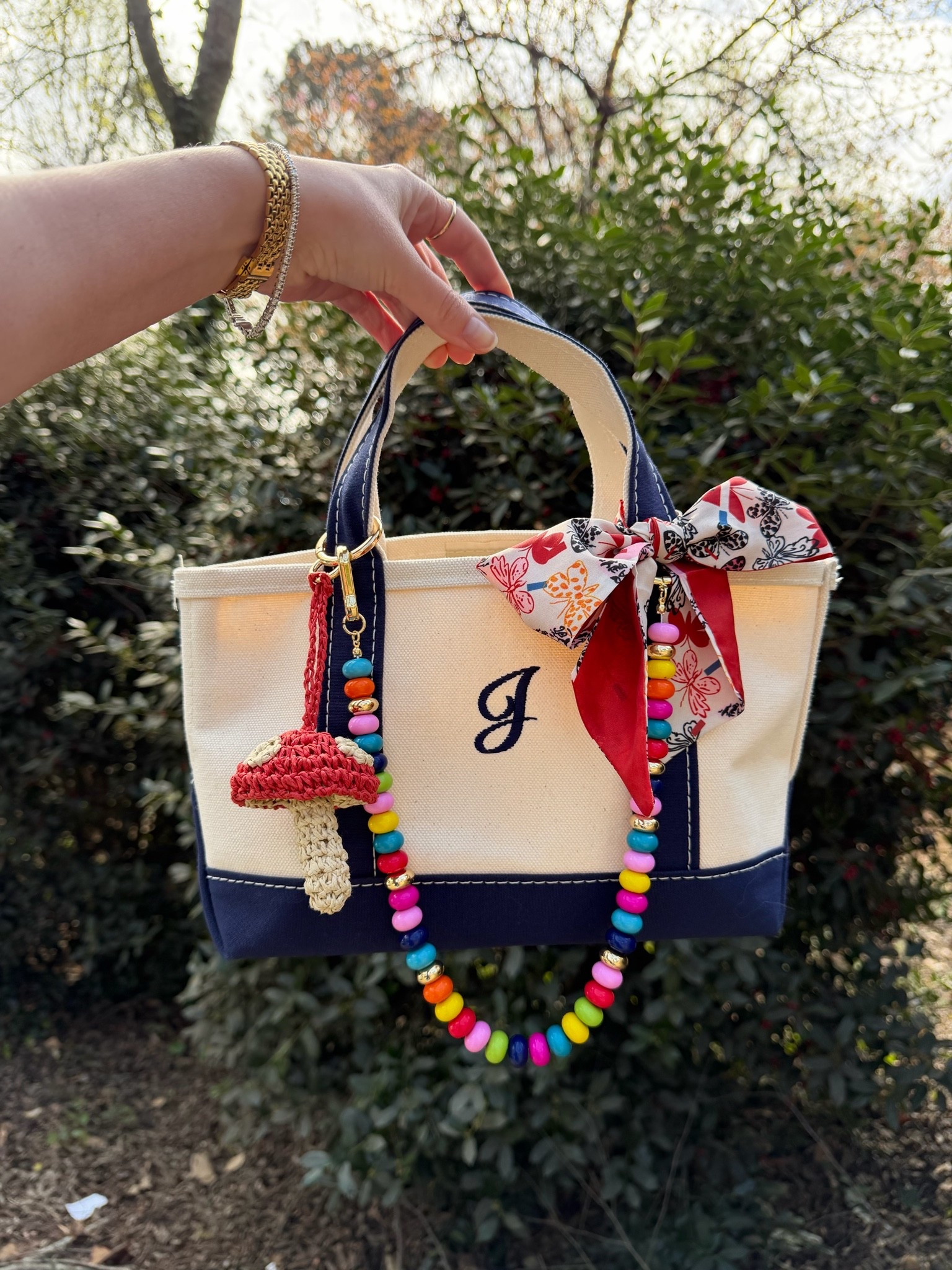 LL bean mini boat and tote
Baublebar beaded chain
Mushroom bag charm