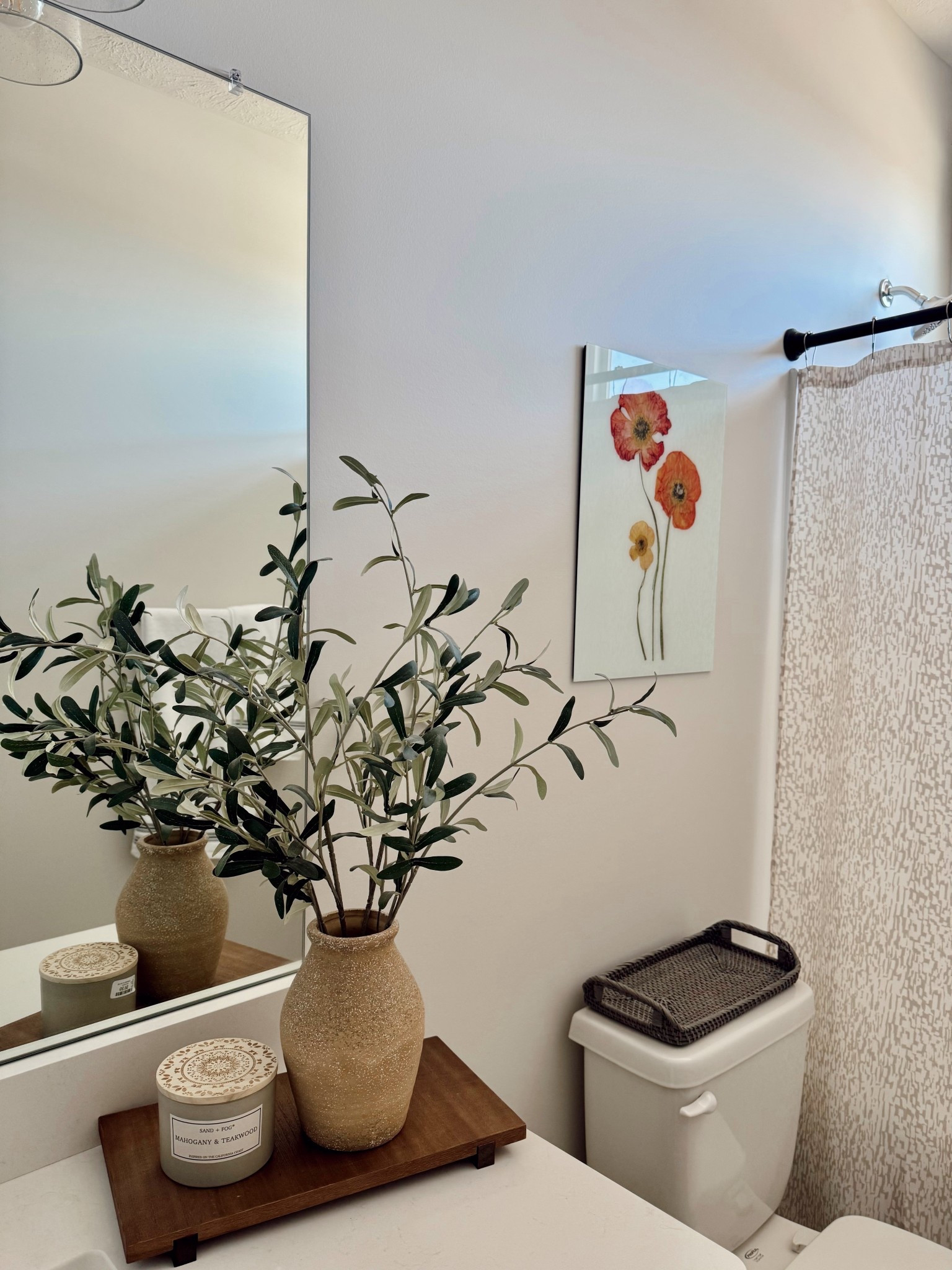 A little guest bathroom refresh can make such a difference 🤍 We made a few small updates to brighten up the space and make it feel more welcoming for guests.

I’m loving this mix of neutral bathroom decor and natural textures. The wooden decorative tray from Walmart, olive plant from Target, candle from Sand + Fog, pressed flower glass frame from Fracture, and decorative tray from Crate & Barrel all work together to create a simple but cozy look.

If you’re looking for guest bathroom decor ideas, bathroom counter styling, or neutral home decor finds, these pieces are such an easy way to elevate your space.

#guestbathroom #bathroomdecor #neutralhomedecor #bathroomstyling #targethome #walmarthome #homedecorfinds #ltkhome #homeinspo 

 #LTKHome #LTKSaleAlert