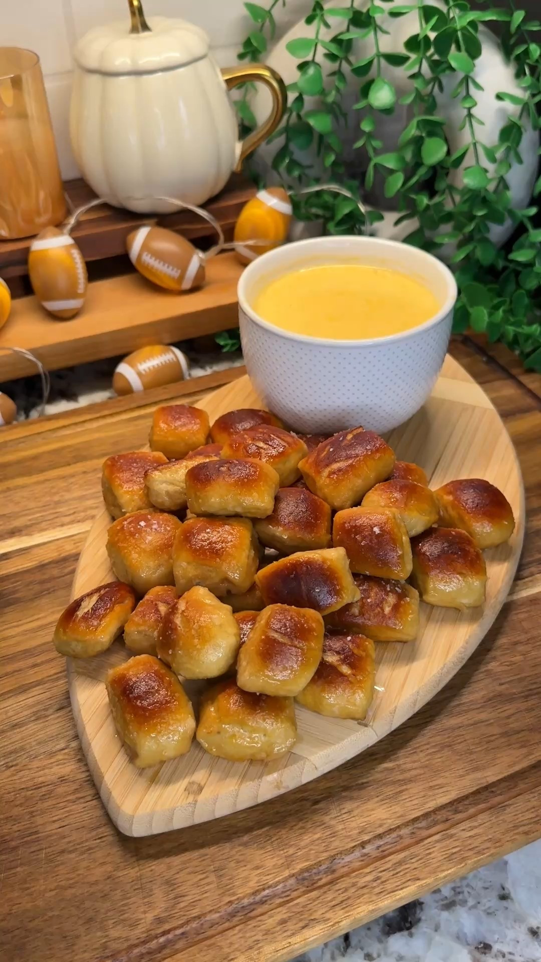tastebud touchdowns, week 1: pretzel bites & cheese sauce🥨🧀🏈
#kitchendecor #cookingessentials #kitchenfavorites #footballdecor

starting off my new series strong with the perfect game day snack! bite sized & so addicting- these will be a hit at your next tailgate or watch party!

pretzel bites:
- 1 tbsp dry active yeast
- 1.25 cups warm water
- 1/4 cup brown sugar
- 3.5 cups flour
- 1 cup baking soda
- 6 cups boiling water 
*bake at 500°F for 5-7 minutes until golden brown
- 4 tbsp melted butter
- 1.5 tbsp flaky salt

cheese sauce:
- 3 tbsp butter
- 3 tbsp flour
- 2 cups milk (use less for a thicker sauce)
- 8 oz freshly shredded cheddar cheese
- 4 oz yellow American cheese
- salt & pepper to taste


#LTKSeasonal #LTKFamily #LTKHome