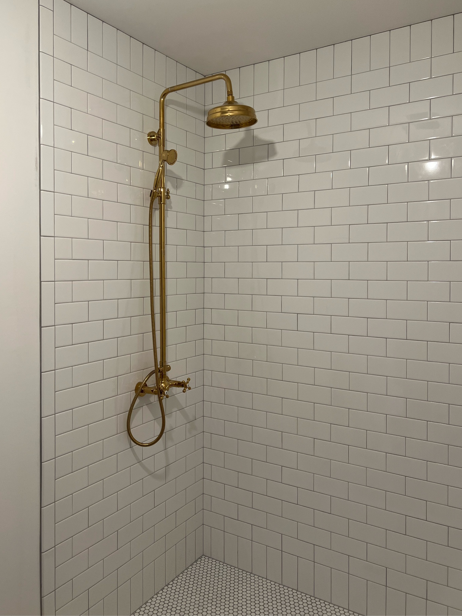 Master shower 
Primary bathroom 
White subway tile
Tile trim
Brass shower system
Exposed plumbing 
Vintage shower design 
Classic bathroom
White and gold 
Rain shower head
Amazon find
High-end dupe
Polished brass
Lifetime brass
Kohler
Rohl
Waterworks 
Shower design
Bathroom remodel
Plumbing fixtures 
Shower head
Faucet 
Amazon Warehouse
Open box 
Penny tile
Gray grout 
Platinum grout 
Handheld shower 

#LTKsalealert #LTKhome #LTKstyletip