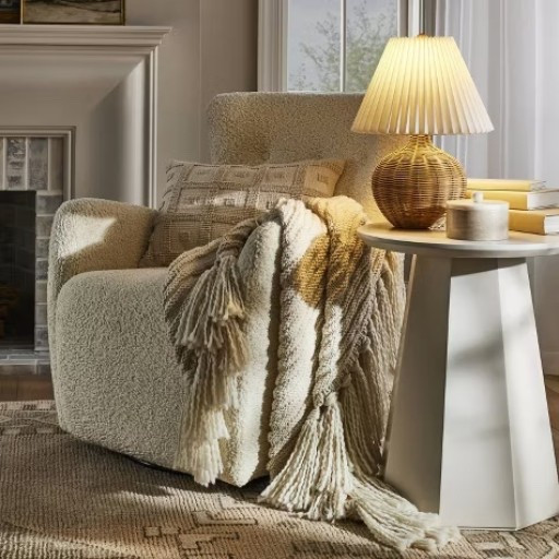 Light up your space in charming style with this Natural Wicker Table Lamp from Threshold™ designed with Studio McGee. This table lamp features a cream-colored woven rattan base with a pleated drum shade for a chic, textured look. The white shade diffuses light for a soft, ambient glow, while the one-way light setting with a simple on/off switch allows for easy operation. Plus, it comes with a 5-foot cord for versatile tabletop placement.

#LTKHome #LTKSeasonal