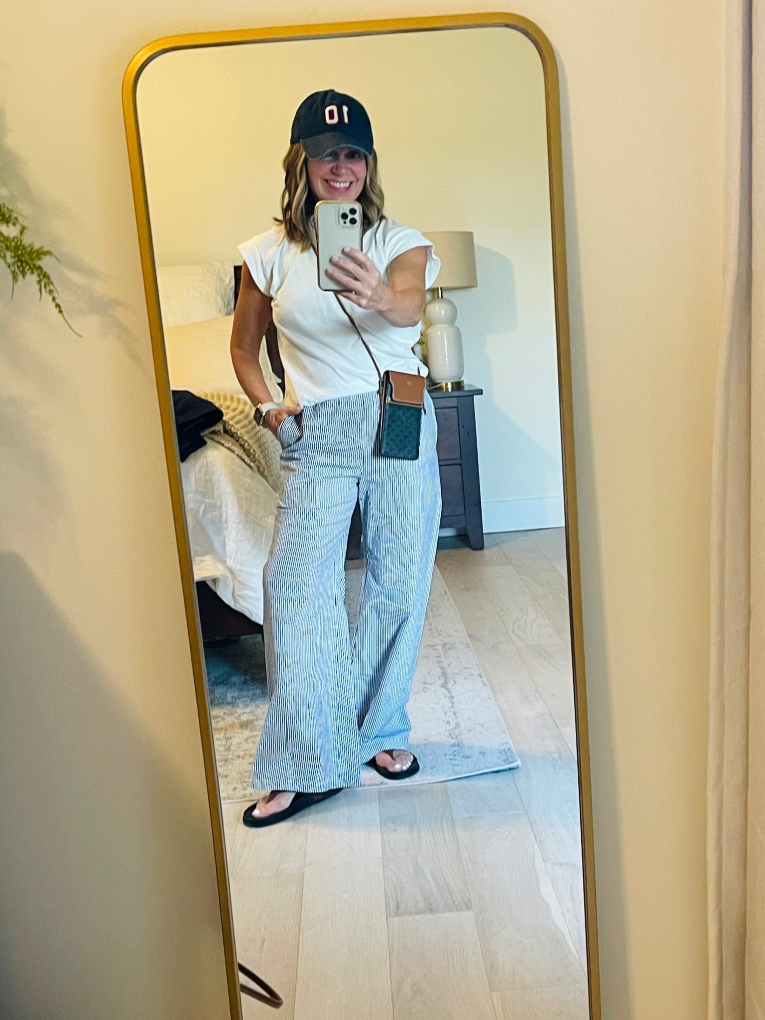 Evening at the ballpark outfit! Love these pants and my sandals are back in stock and a great price!! ⚾️ 

Pants are on sale, tts wearing XS petite 
Sandals are tts and very comfortable - great alternative to birks! 
Tee is old target, hat is old JCrew.
#ltkpetite #ltkover50 #sportingeventoutfit

#LTKOver40 #LTKStyleTip