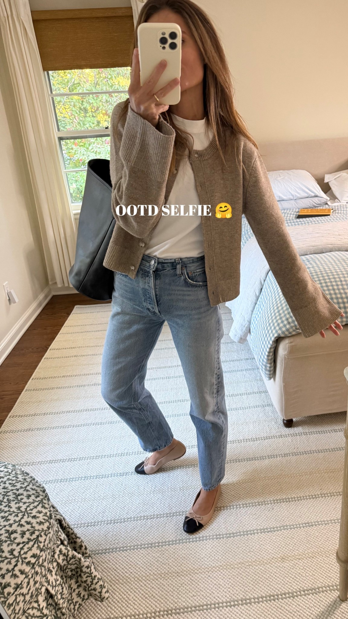 Another snap of my OOTD. 

Check out the bell sleeves on this &OTHERSTORIES cardigan giving serious Khaite vibes at a fraction of the price. This is one of my favorite daily Fall outfits. Favorite AGOLDE jeans, COS white tee, best J. Crew leather tote, and a great set of ballet flats from J. Crew factory 58% off coming in under $50! 

Sizing notes: 

Jeans run tts, in a 25. If in between, size up. Cardigan: sized down to an XS. Tee: in a small - one of my all time favorite white tees.

Have a great Friday!
Xx Meg 

#LTKFindsUnder50 #LTKSeasonal #LTKSaleAlert