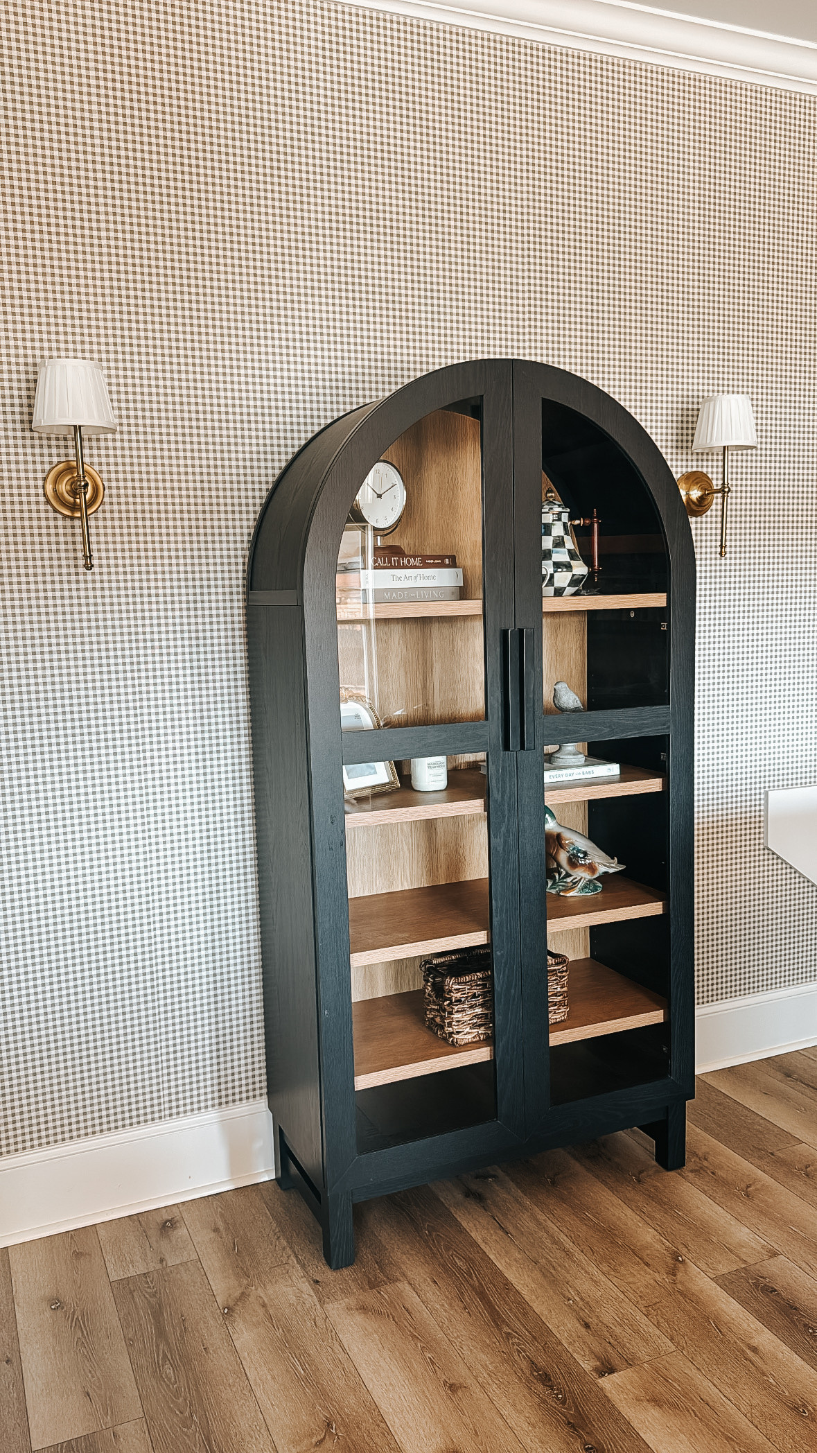 A little refresh can go a long way. 🤍 This arched cabinet is a Walmart find (on sale now!), and the gingham wallpaper is from Target! Budget-friendly style that looks high-end. ✨ The gold sconces are the perfect addition as well. 

 #LTKHome #LTKSaleAlert