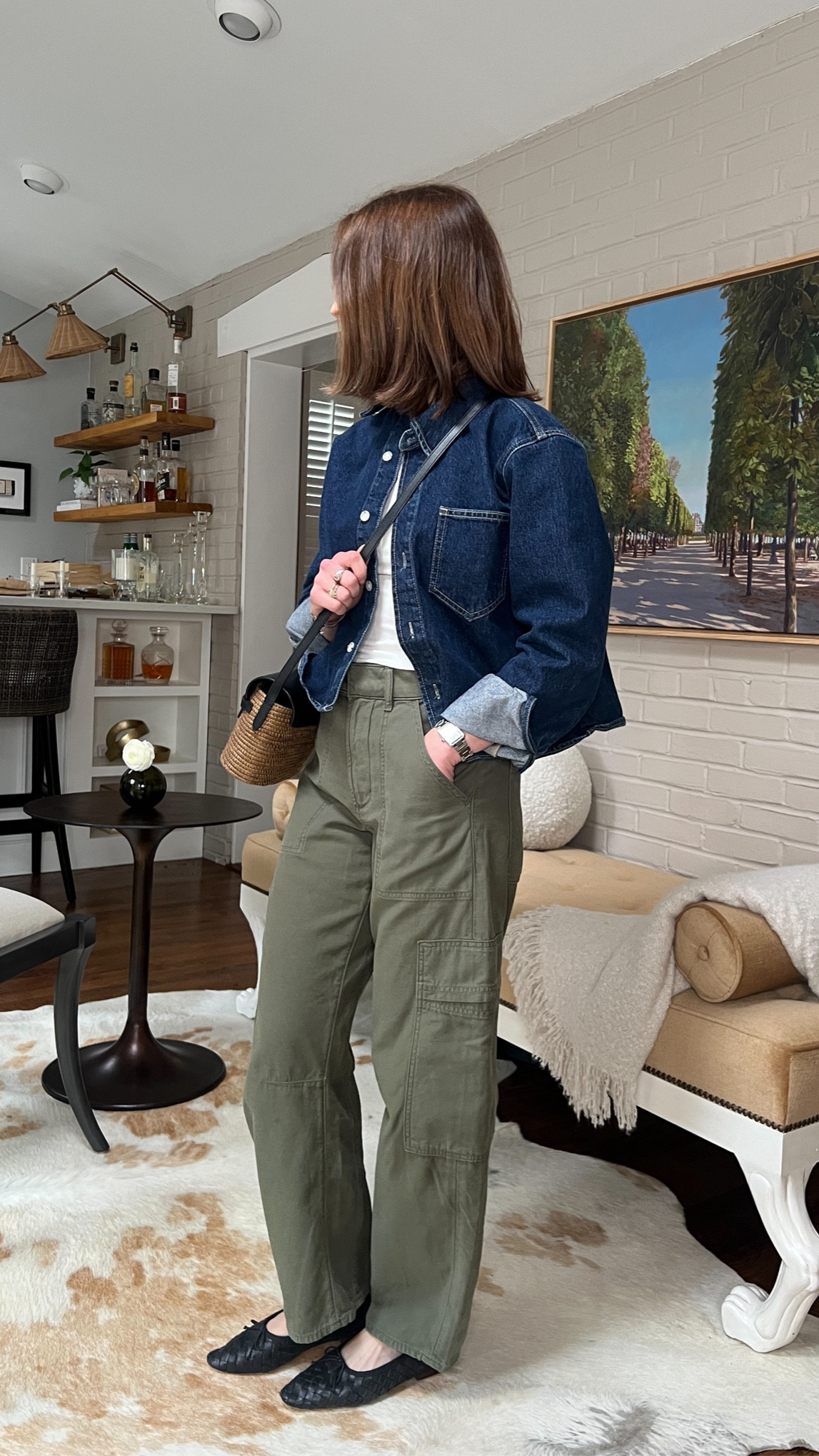 Denim shirt La Ligne code KELLYM10
Green cargo pants citizens of humanity 
White tank top favorite daughter
Black ballet flats Loeffler Randall
Rattan/raffia crossbody bag

Spring casual outfit
Spring style 

#LTKshoecrush #LTKstyletip