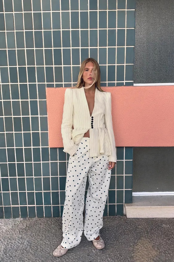 Collarless blazer with long sleeves and shoulder pads. Flared hem with pleats. Front button closu... | Zara US