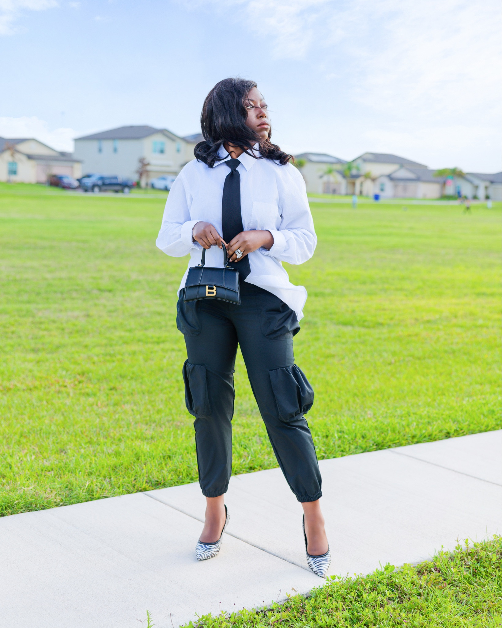 This Business & Personal. 🤍🖤Supported my son today at his STAR Student of the Month Award Ceremony for his academic achievements and exceptional behavior and you know it’s only right that I showed up in style. 

Shop this look

Shirt & Tie: Hubby’s Closet
Cargo Jogger Pants: @forever21 
Heels: @macys ( @macysstylecrew )
Bag: @balenciaga 

#MacysPartner #MacysStyleCrew #MacysStyle