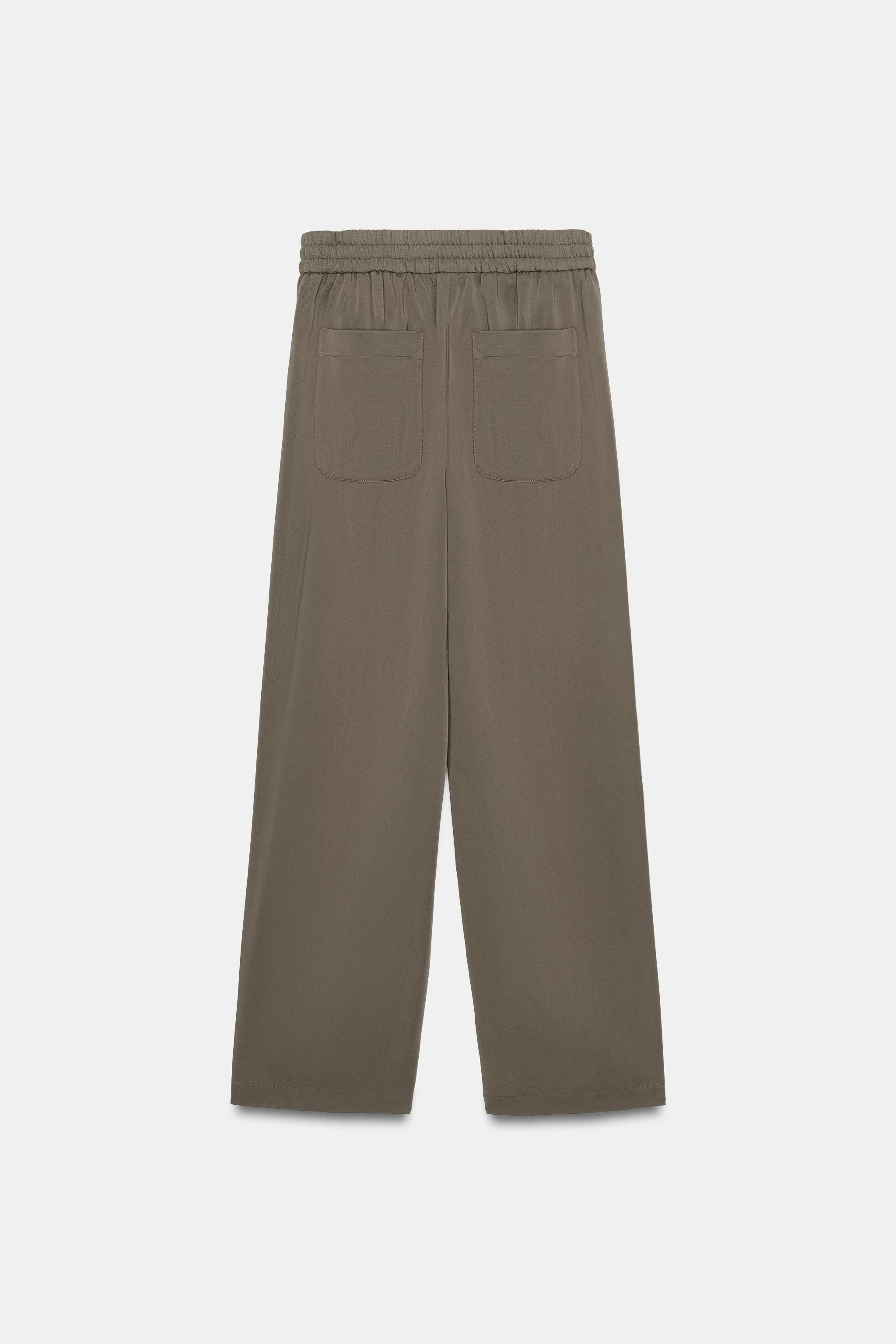 Model height: 173 cmHigh-waist trousers with an elasticated back waistband. Pronounced front seam... | Zara UK