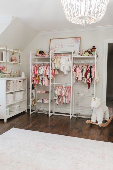 Organizing baby’s wardrobe made easy! Check out our open clothing rack for a stylish nursery. #BabyStyle #NurseryOrganization #BabyFashion 