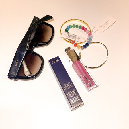 Take a peak at what essentials I can’t live without! Currently obsessed with stackable bracelets, and of course: my oversized sunnies, and glossy lips  

#LTKU #LTKunder100 #LTKbeauty