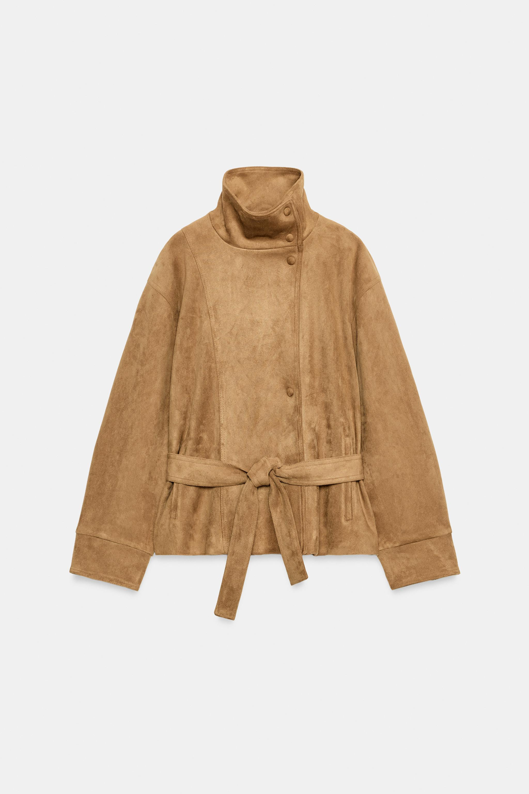 High-neck jacket with long sleeves. Front pockets. Features a matching fabric belt and gathered d... | Zara DE