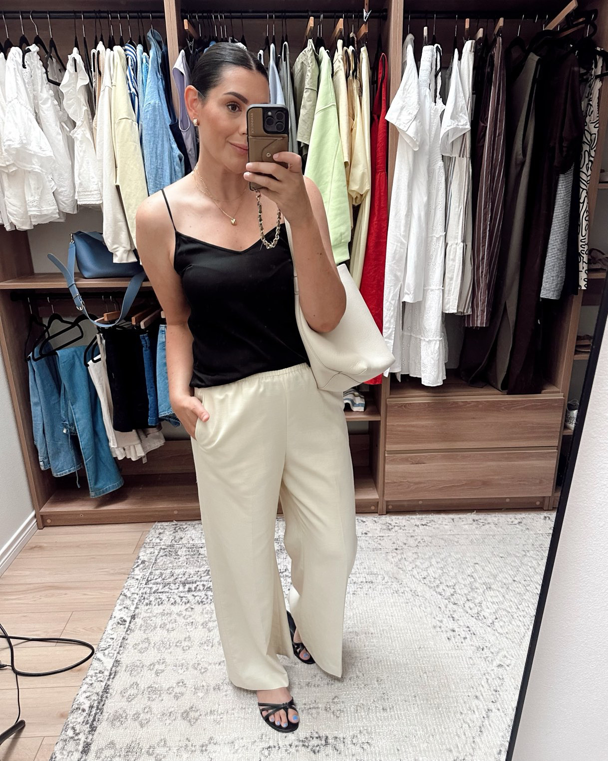 One of my favorite little tanks that make any outfit so easily chic. I'm in the large of this silk tank. @quince

I'm in the large of the @jcrew pants but they run big! On sale right now! 

 