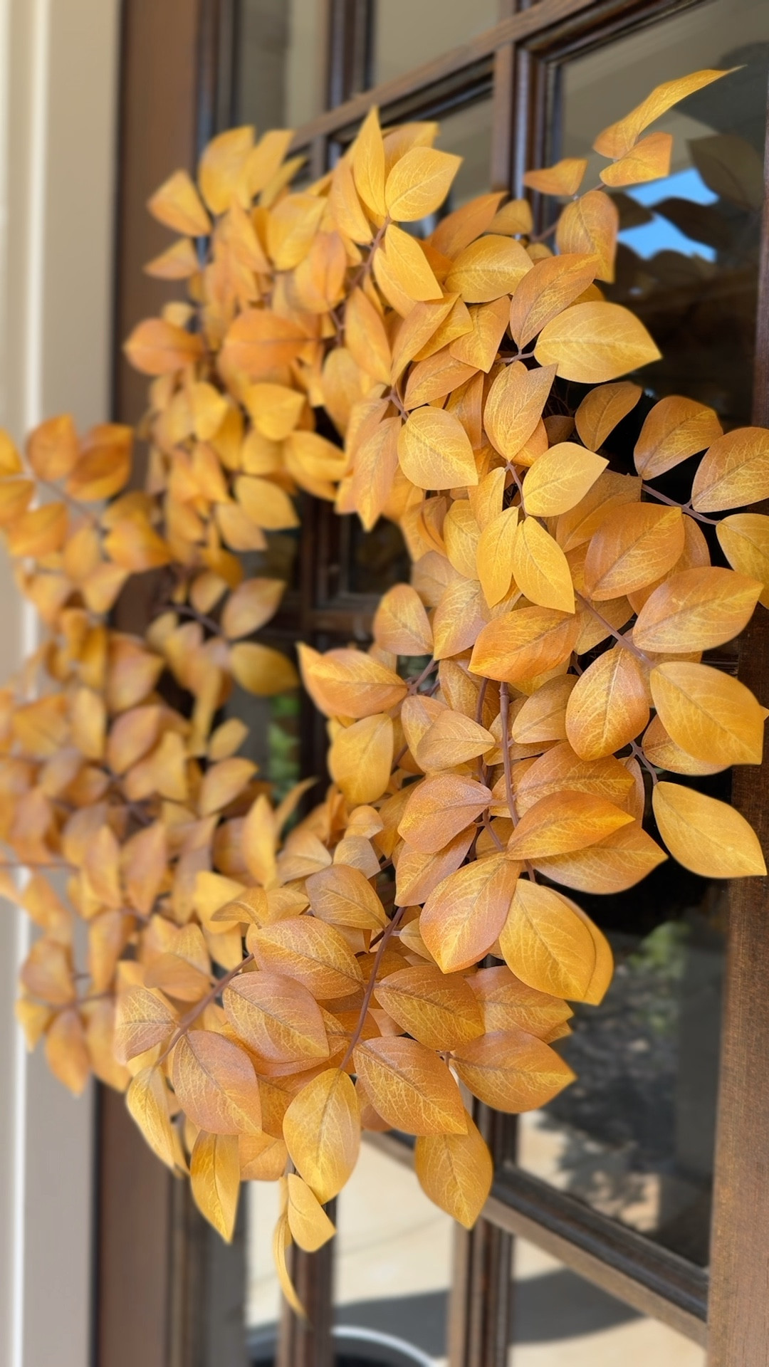Welcome Autumn with open arms and a cozy front door! 🍁 This Fall wreath adds a touch of seasonal charm that invites warmth and joy into your home. #falldecor #frontdoorstyle #autumnvibes