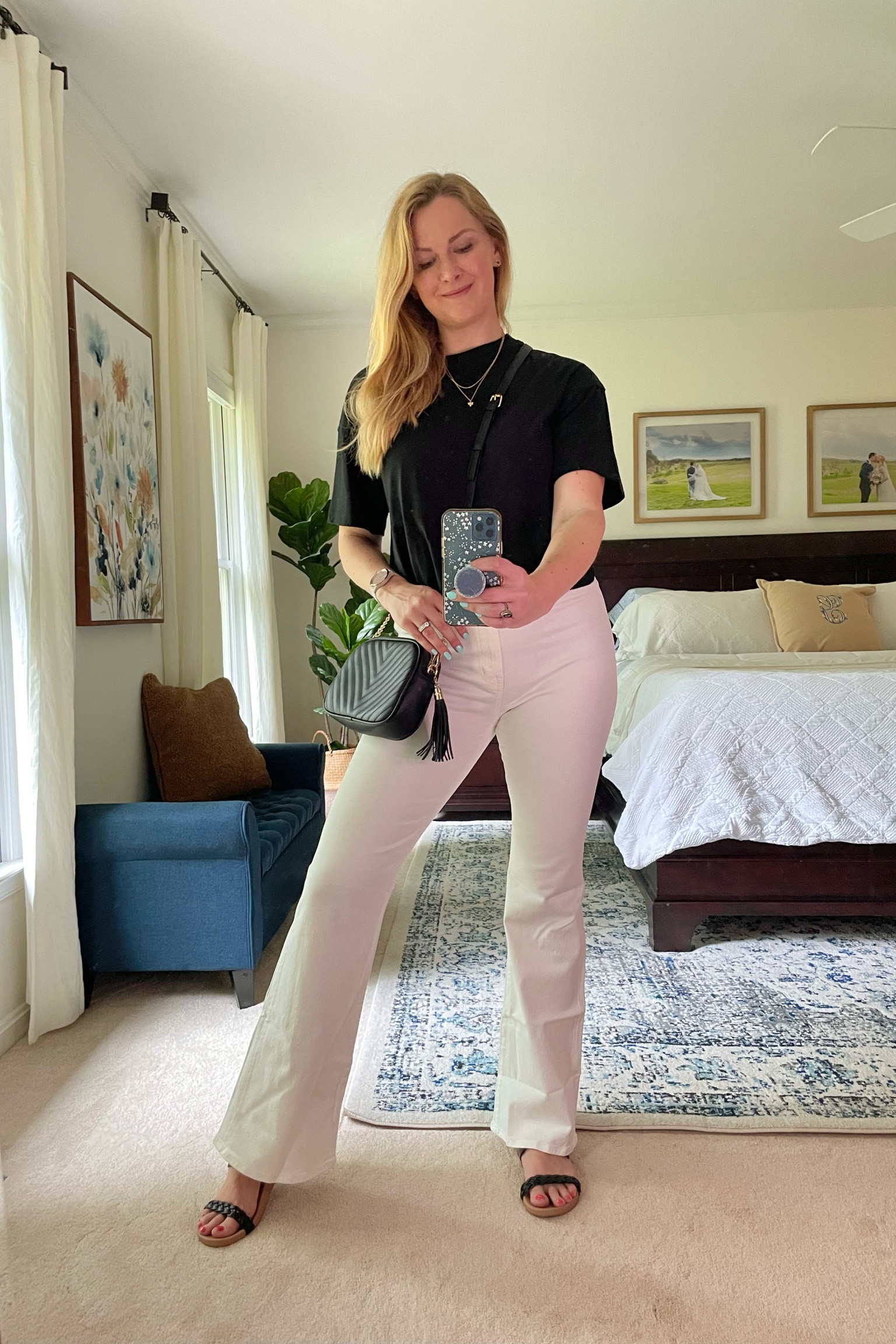 Cropped black tee with flared high waisted white jeans

White flare denim has stretch. Got my normal size.

Tee and a quilted crossbody bag are affordable finds

Strappy braided black sandals are on sale rn

#LTKitbag #LTKstyletip #LTKSeasonal