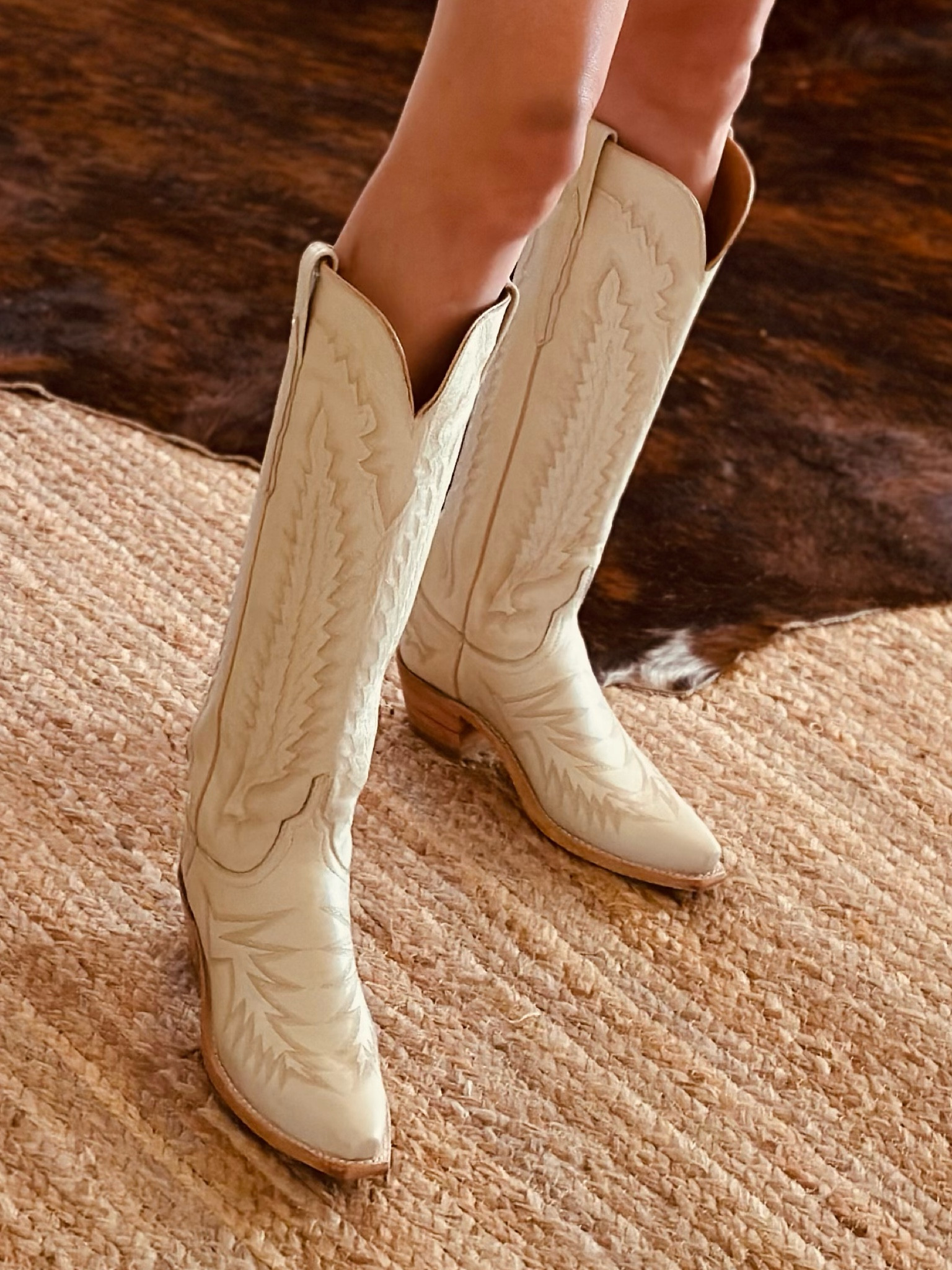 Boots have become a must-have wardrobe item and I have found that I wear them daily. I have limited space at our ranch house so I have to be very choosey with my purchases and after a lot of consideration, I got these pearly colored boots- my second pair of his exact style. 
These are handmade in the USA and have an 18inch shaft, which is higher than your traditional boot. I like the height- it’s much more flattering on my leg than a mid height- and much more dramatic. 
Be sure to order a half size doen as these run a touch large. 

#LTKwedding #LTKshoecrush #LTKGiftGuide