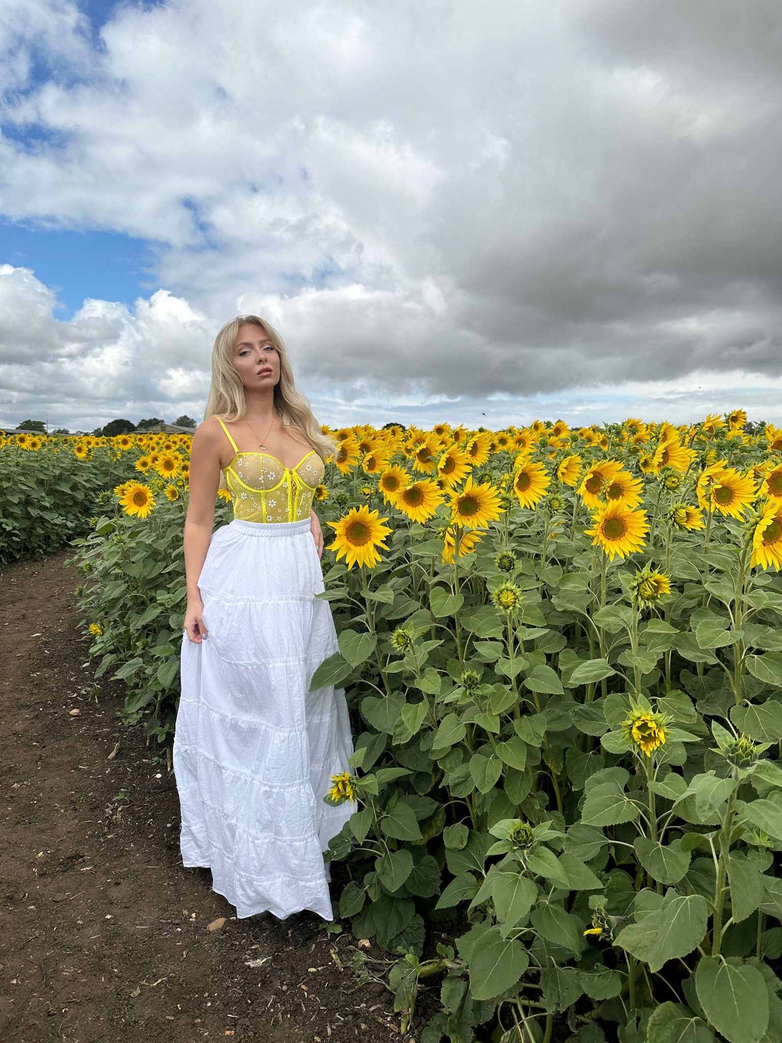 Outfits to pick flowers in. Yellow corset and white maxi skirt  

#LTKstyletip #LTKSeasonal #LTKunder50