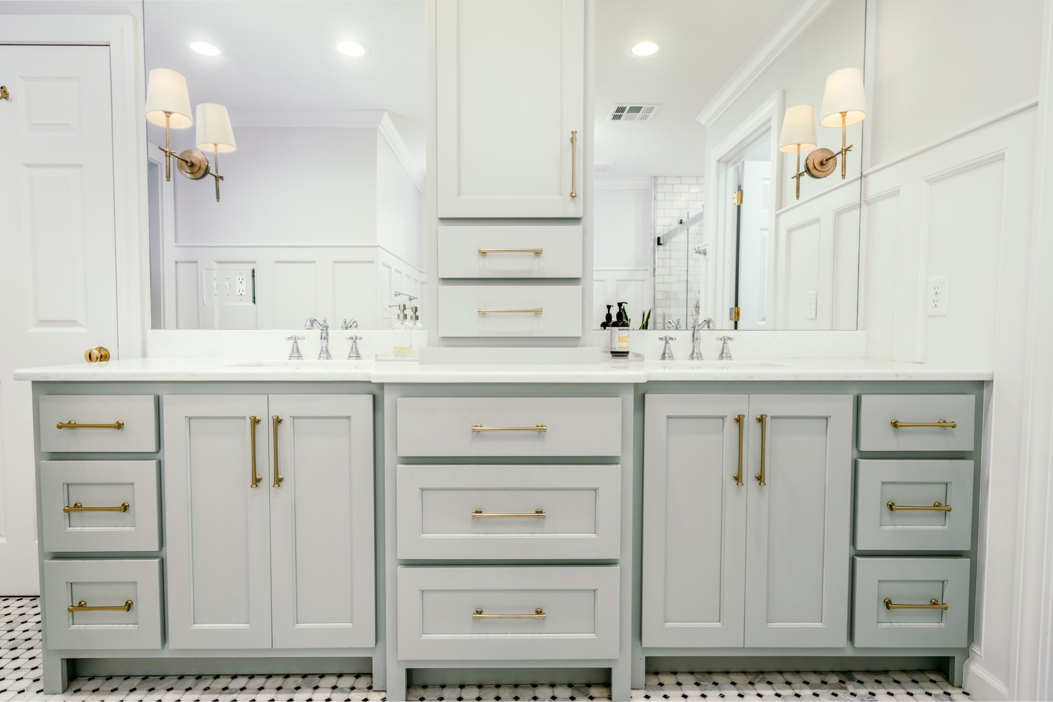 Things we love about this bathroom transformation - the sconces, simple mirror, gorgeous blue cabinetry, and  classy gold pulls! 

#LTKFind #LTKstyletip