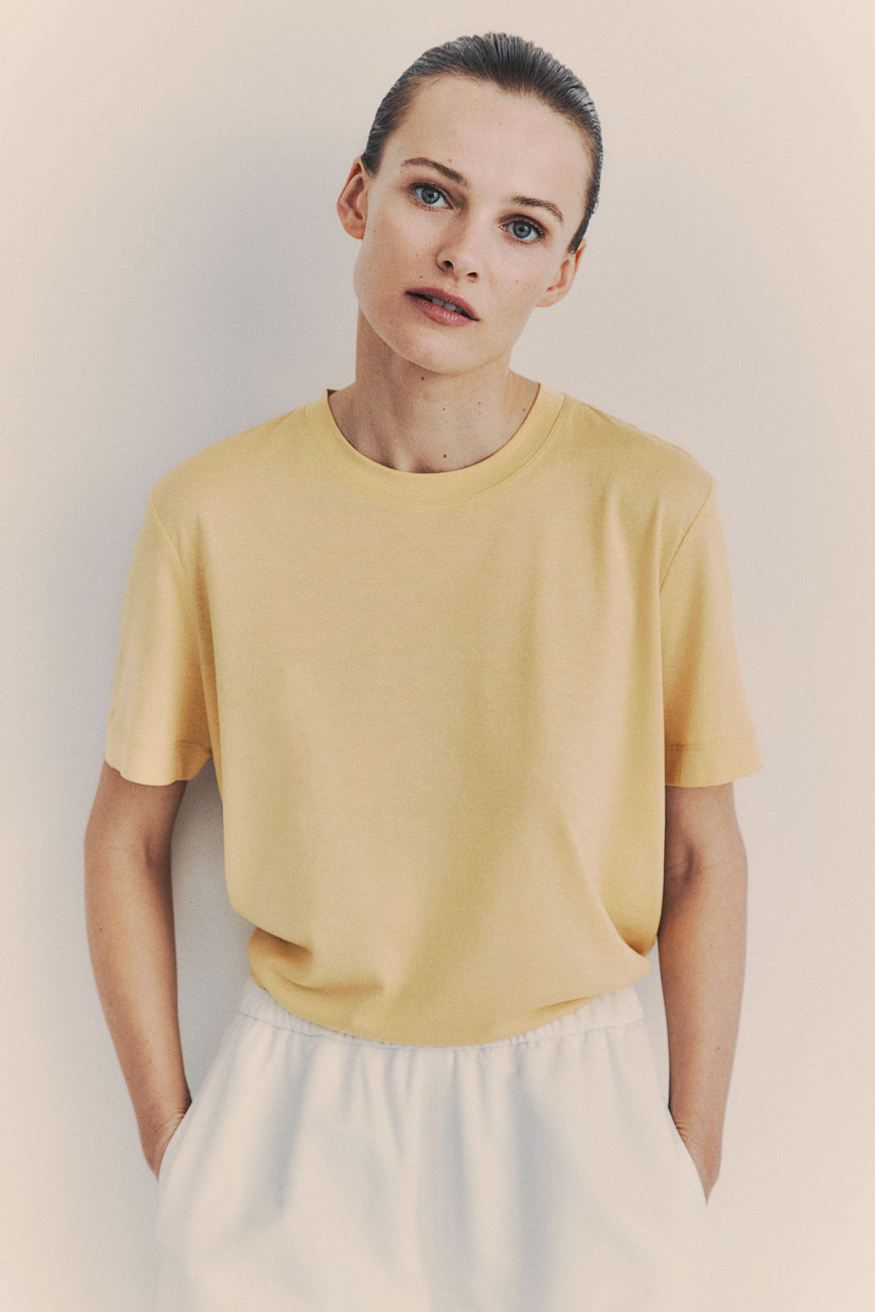 Silk-blend T-shirt - Round neck - Short sleeve - Light yellow - Ladies | H&M GB | H&M (UK, MY, IN, SG, PH, TW, HK)