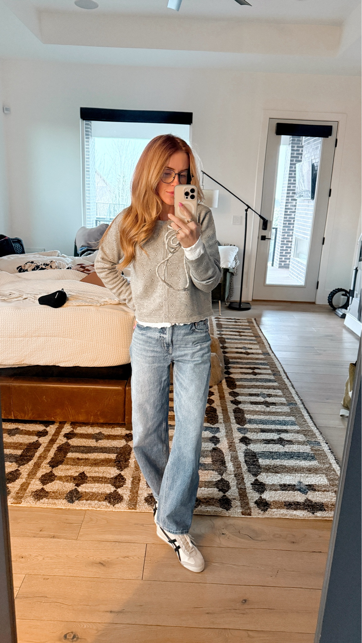 Wearing my favorite ruffle shirt under. I get the small and have worn it at least 3 times a week as of late.. it's so cute by itself + under sweaters!

Cardigan is from Bohme! Love the dainty little details. Wearing a small. 

I've raved about these pants for years now + have multiple washes of them. Wearing my true size here. Code TARA gets you 15% off!

I wear these shoes constantly, if Emery hasn't stolen them from me! haha They're so dang comfy. I am an 8-8.5 in shoes and get the 39.5 in these.

Phone chain is from amazon!

#LTKootd