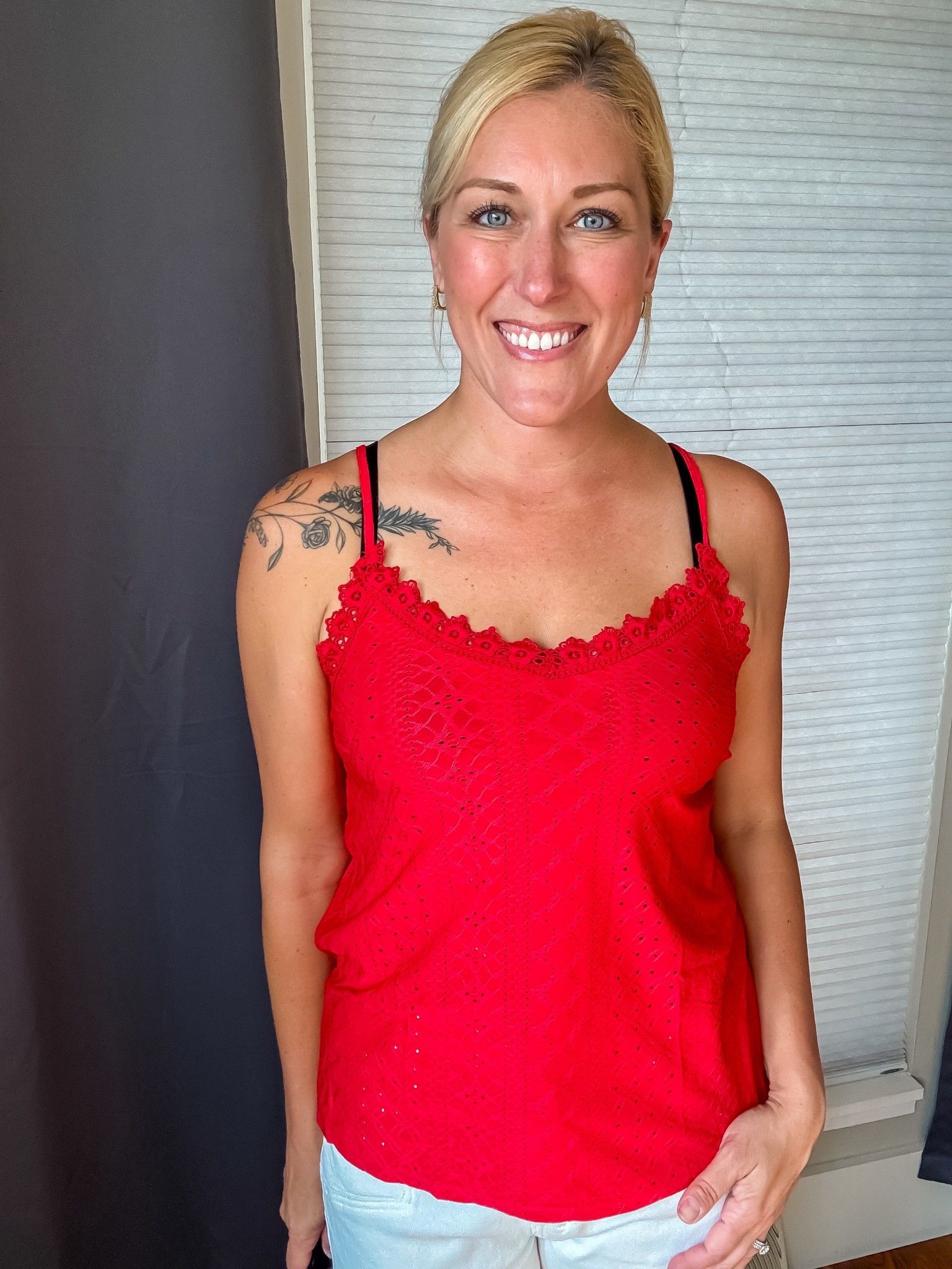 This red eyelet tank has a pretty floral lace neckline and adjustable straps for the perfect fit. Light, airy, and slightly sheer—it’s giving all the summer date night vibes. ❤️