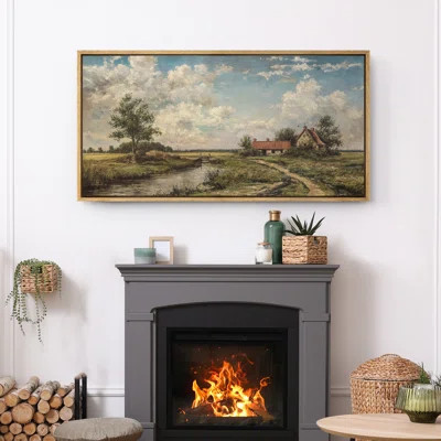 oversized framed canvas of a serene French countryside landscape over a fireplace