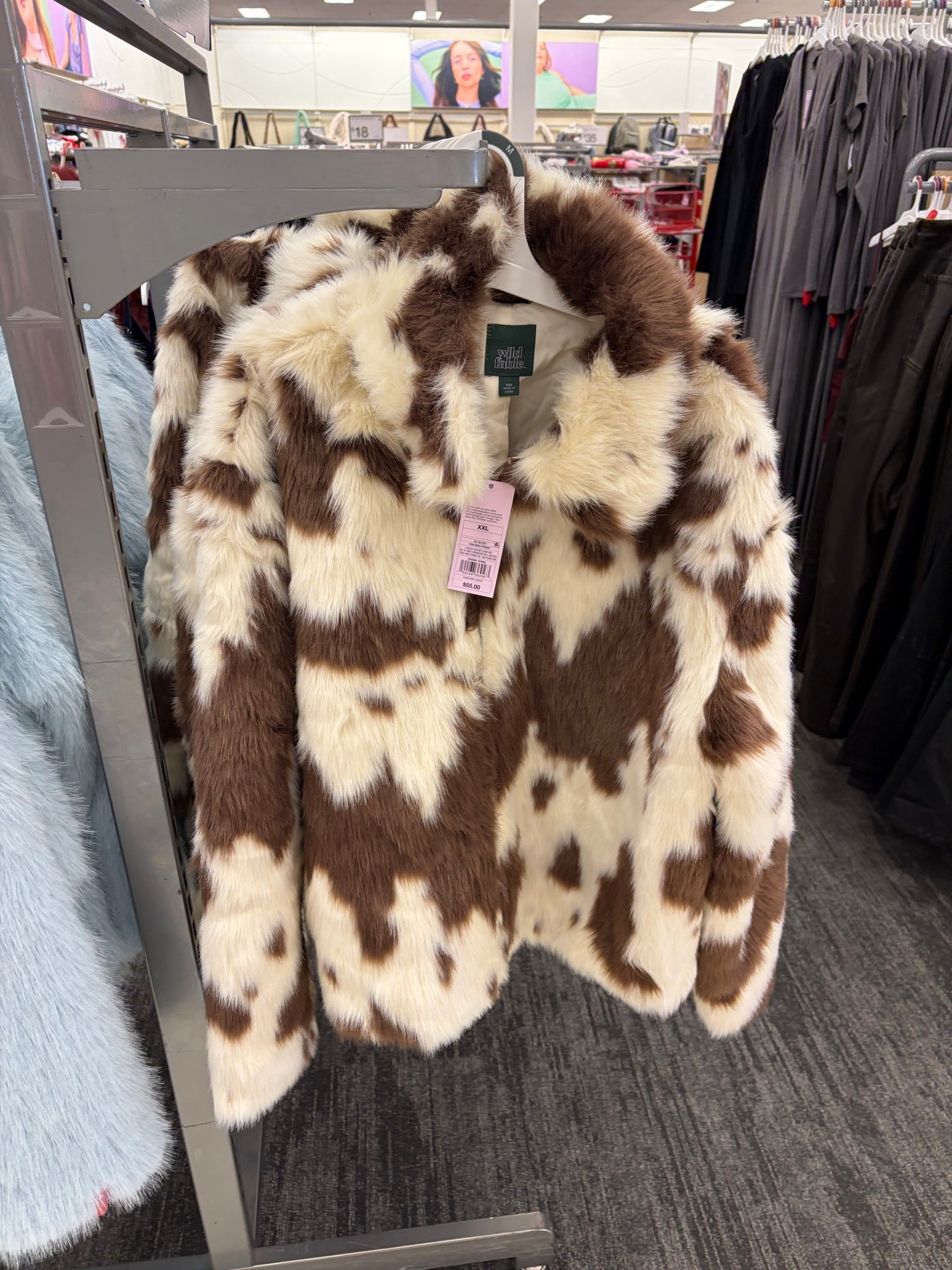 Faux-fur jacket at Target in light brown with darker brown cow print. Front zipper and pockets 

Wild Fable coat

#LTKFindsUnder100