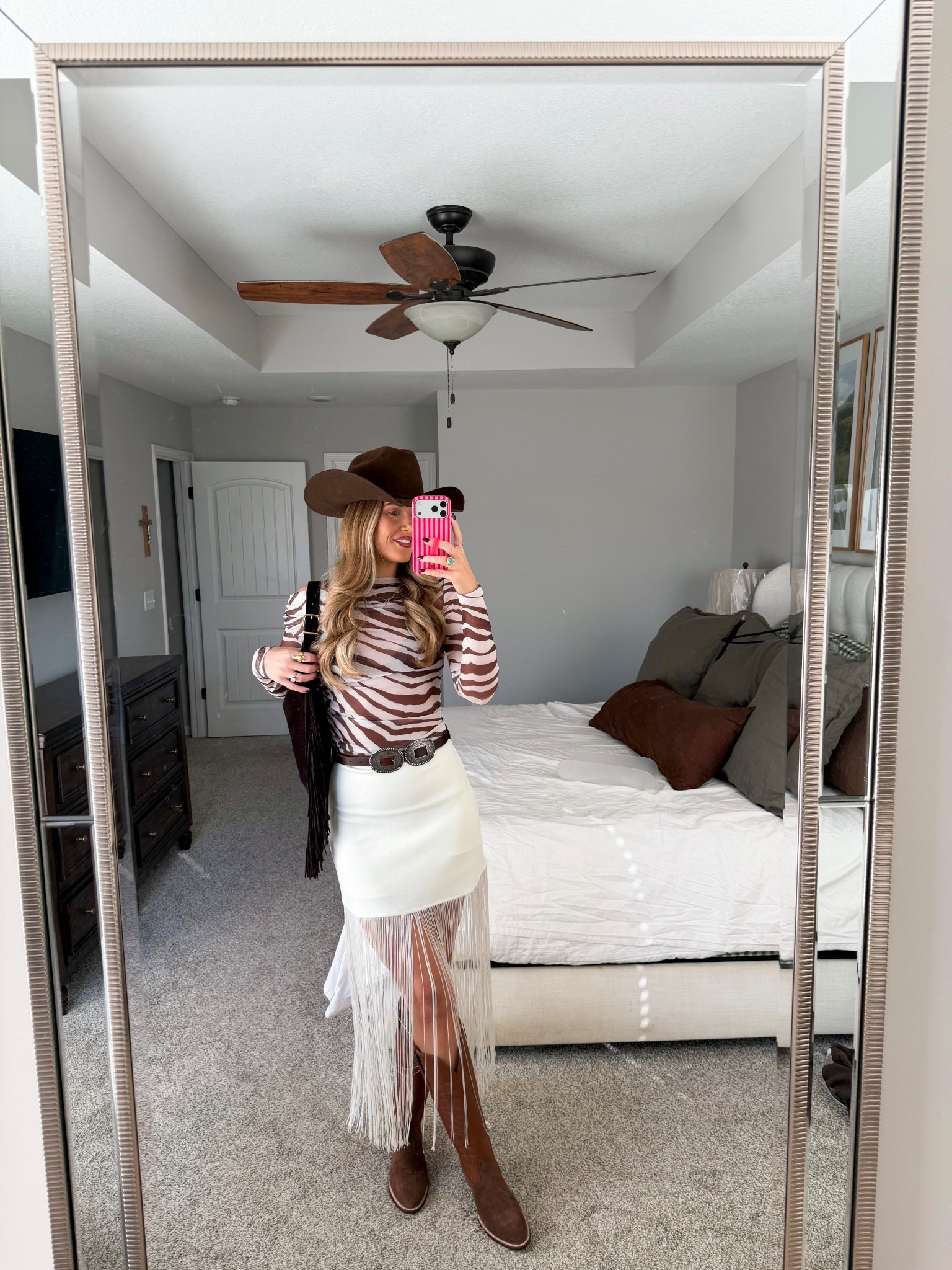 zebra top in a 4, skirt in a 4 (part of matching set!) true to size in boots, hat is rodeo king from rods but linking similar 

rodeo western chic outfit 

#LTKootd #LTKgrwm #LTKTall