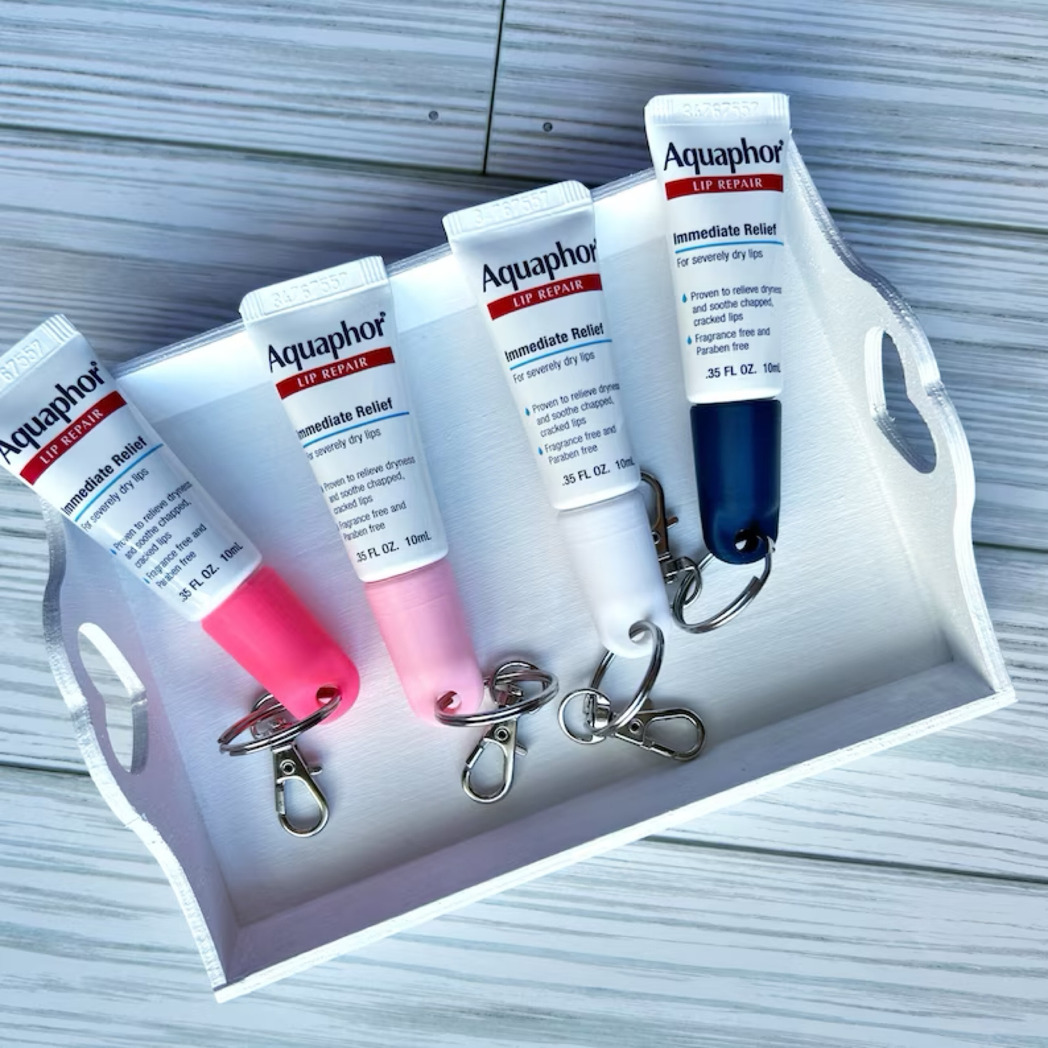 Aquaphor Keychain Cap - Aquaphor Lip Repair 0.35 FL OZ(10mL) - Lip Balm Holder - Purse Attachment - Lanyard Attachment - Lip Gloss Keychain

Preppy, preppy gift, bachelorette, bridesmaid gifts 

#LTKfindsunder100 #LTKparties #LTKfindsunder50