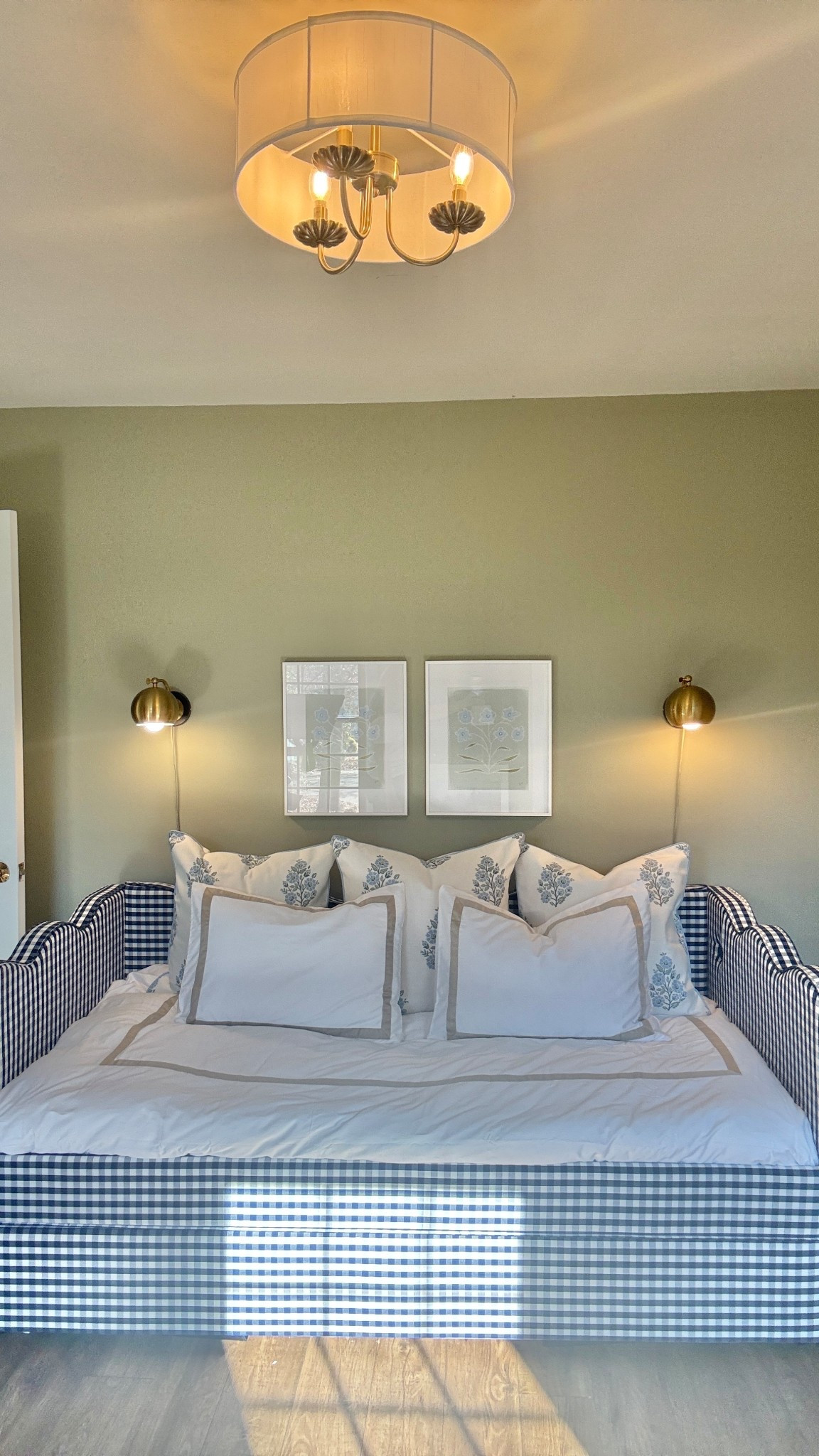 This fourth bedroom has worn many hats for us—closet, home gym, family hangout, and now the perfect guest space—and this daybed from Wayfair is what finally made it all click. It’s a twin daybed that doubles as a sofa for movie nights, has a second twin tucked underneath for guests (or kids!), and can even convert into a king when we’re hosting a couple. Smart, space-saving, and so versatile.
I also want to note the bedding is from Wayfair too. I have this same duvet cover and shams on my own bed and knew it would be perfect here. I chose the beige trim this time—it complements the art so beautifully and adds that subtle grandmillennial touch. Plus, it’s cotton sateen (my favorite): silky, cool to the touch, and still breathable.
And don’t skip the details—the wire plug-in sconces are also from Wayfair and were the perfect solution since we don’t have room for nightstands. They have an easy little clicker you can reach from bed and add the prettiest evening glow.
From sofa beds to smart lighting, it’s all about pieces that make every inch count ✨ #ad

#wayfairpartner #Wayfair #NewYearNewYou @wayfair 

#LTKKids #LTKHome #LTKSaleAlert