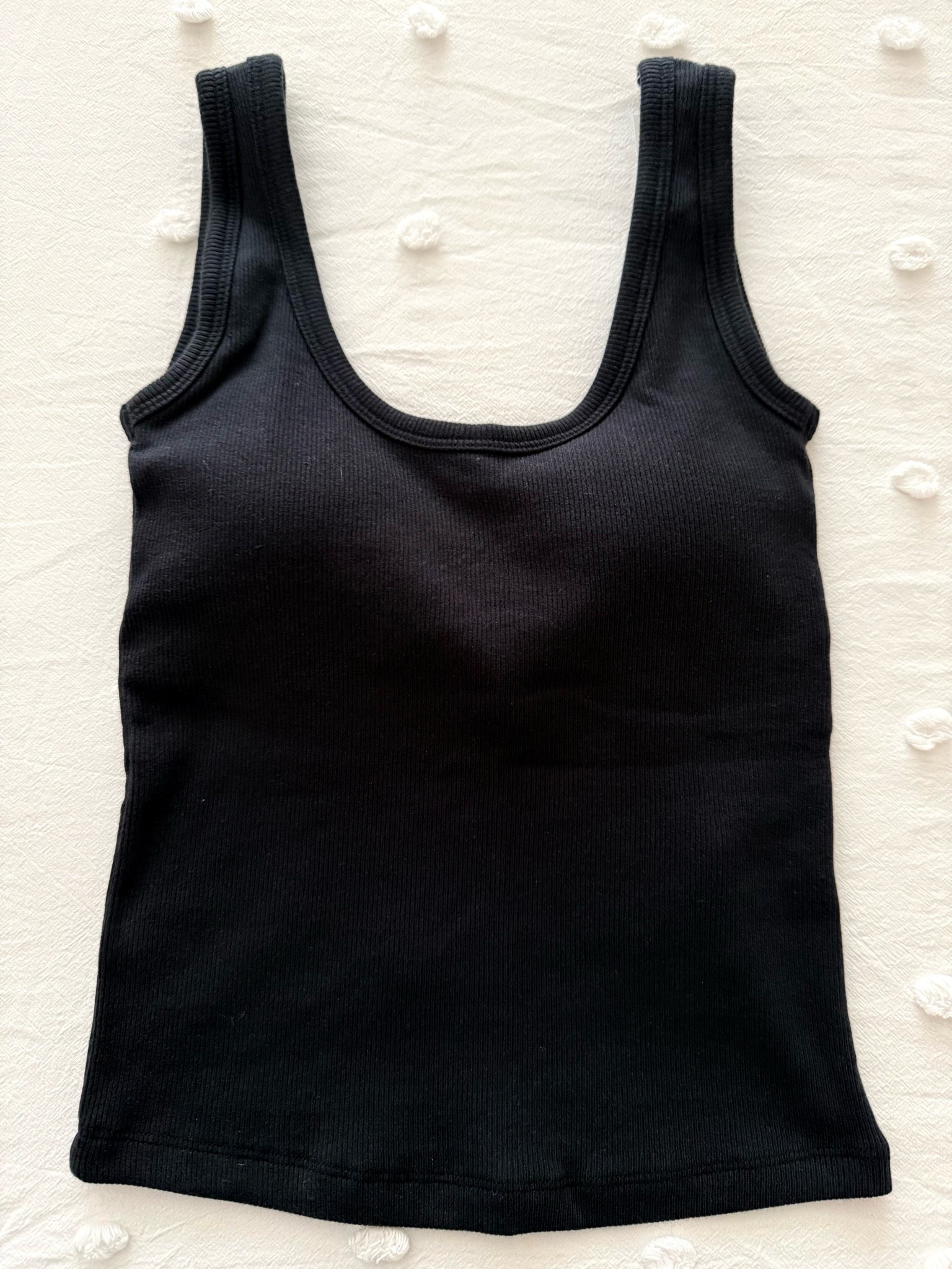 The Bra-Free Rib Scoopneck Tank, a bestseller from Abercrombie, is a slim-fitting tank made of 95% cotton. It features a shelf bra with removable pads for added coverage, all-over ribbed detailing, and a scoop neckline. I recommend sizing up.

#LTKSeasonal #LTKActive #LTKmomlife