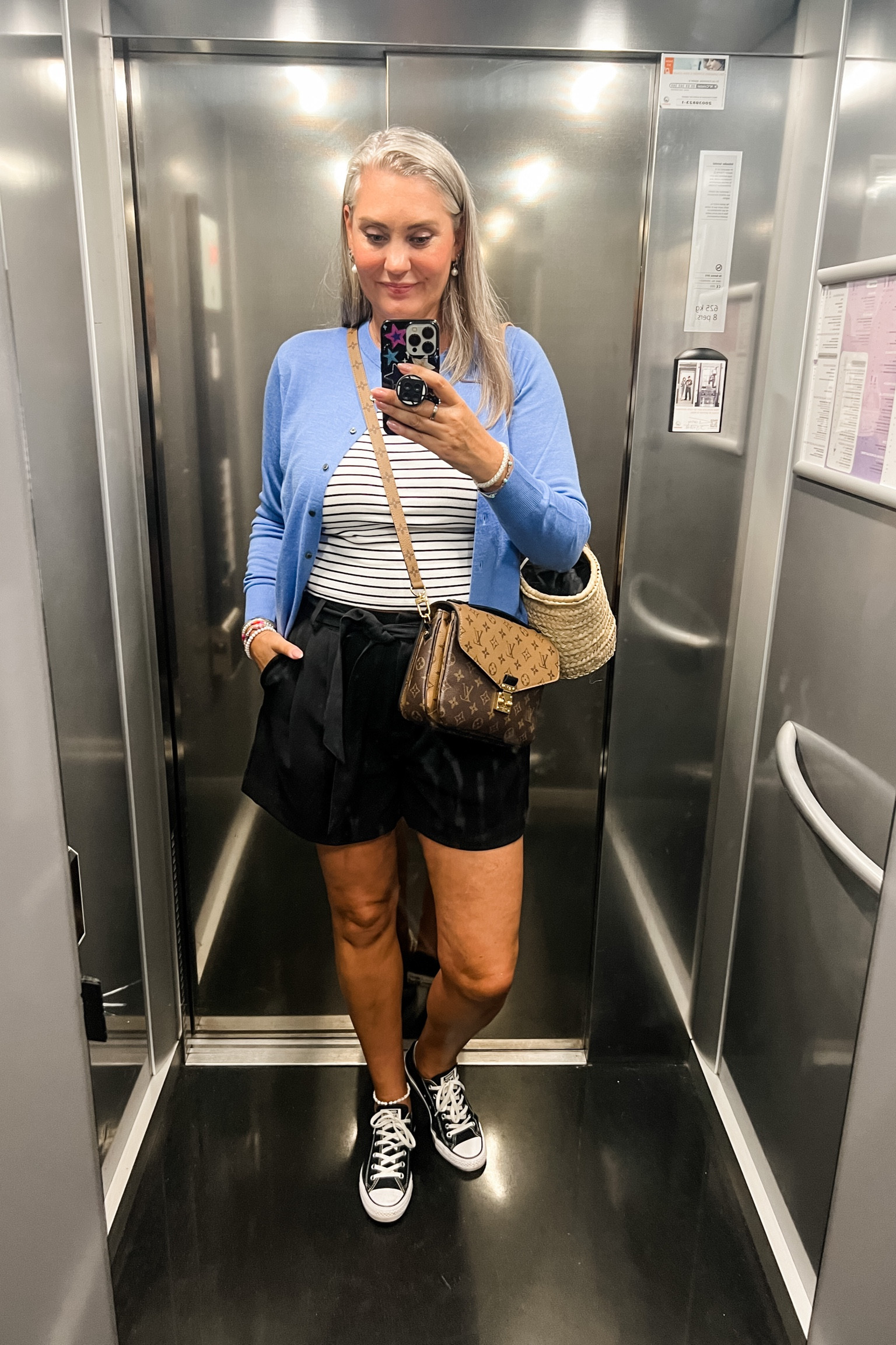 Ootd - Friday. Black paperbag waist shorts (Shoeby), viral striped Uniqlo bra top, extra fine merino wool blue cardigan, converse all stars, Louis Vuitton Pochette Métis reverse bag. Rattan bag (Marrakech).



#LTKsummer #LTKeurope #LTKstyletip