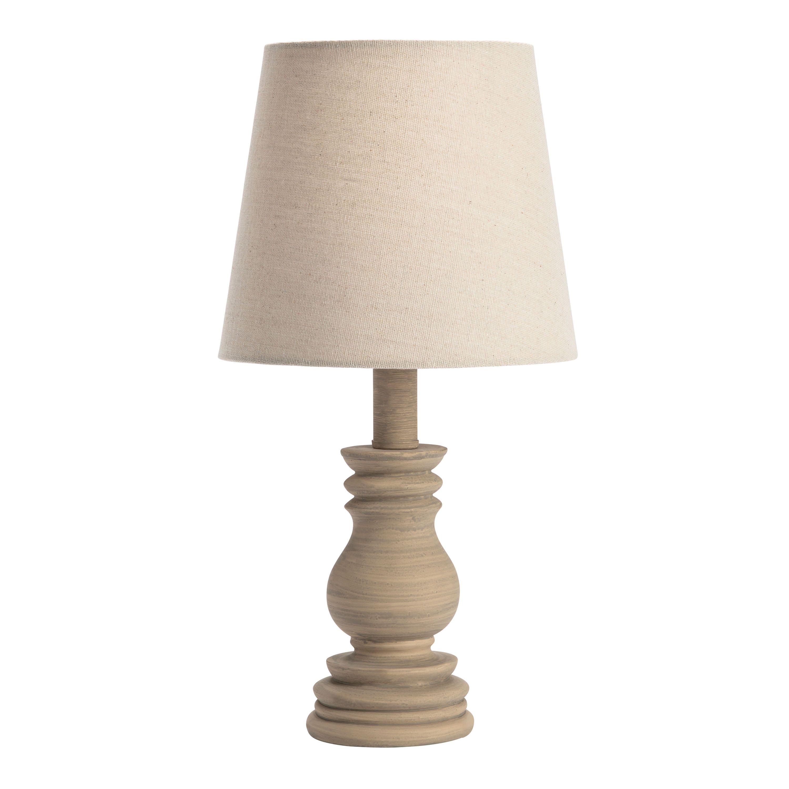 Kenne Distressed Cream Turned Table Lamp | World Market