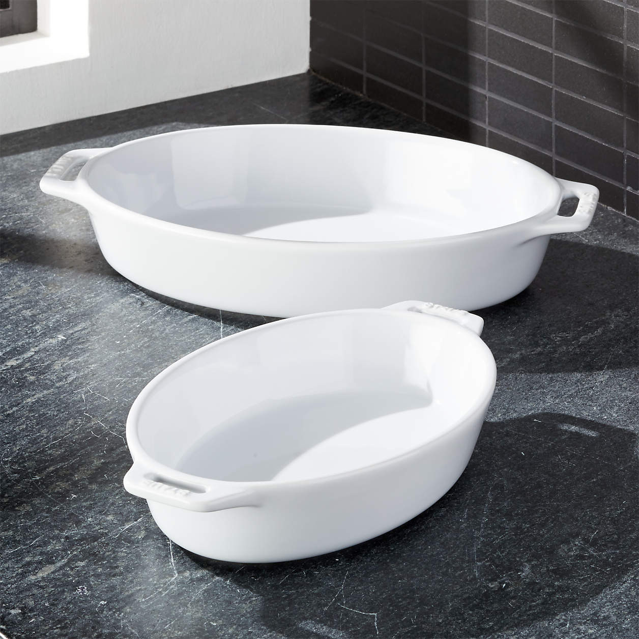 Staub White 2-Piece Oval Baker Set + Reviews | Crate & Barrel | Crate & Barrel