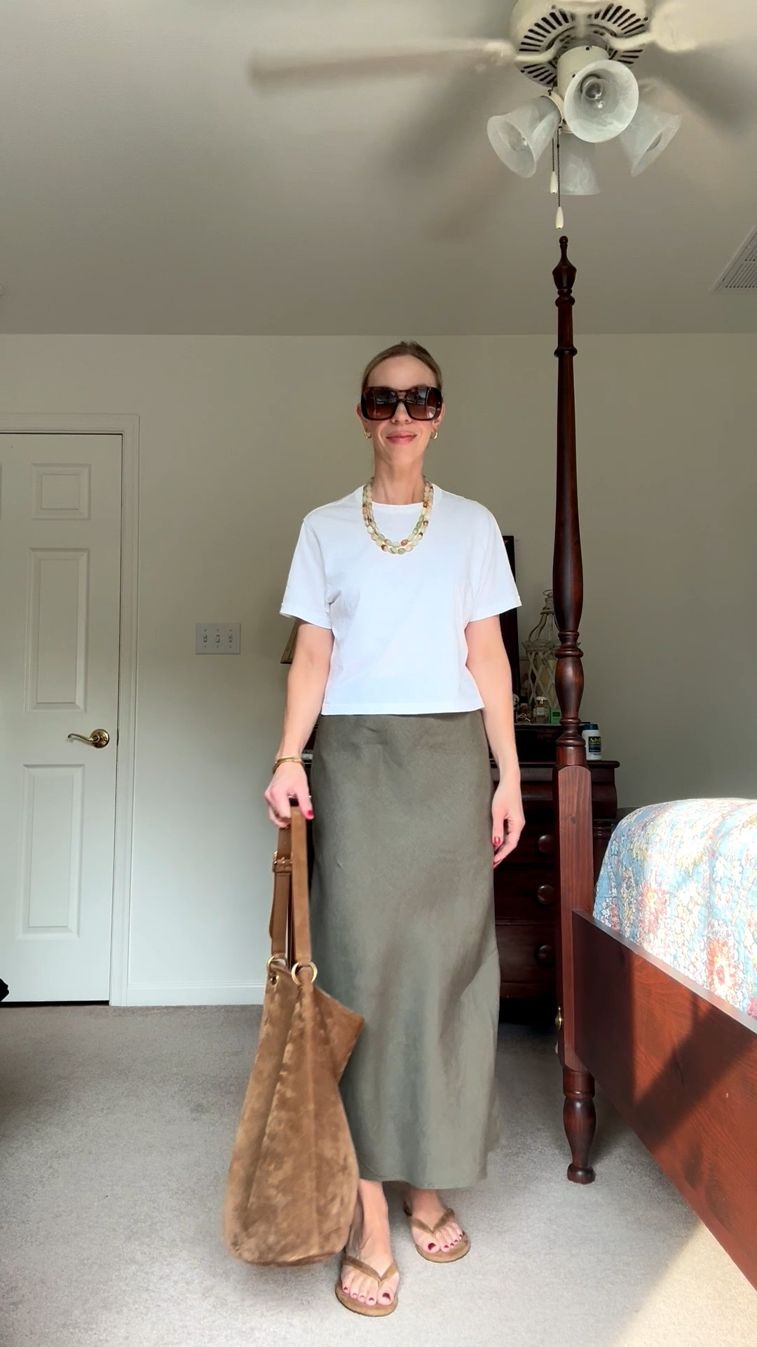 Summer to fall outfit, @Quince line skirt, olive green, suede bucket bag

#LTKOver40 #LTKSeasonal #LTKSaleAlert