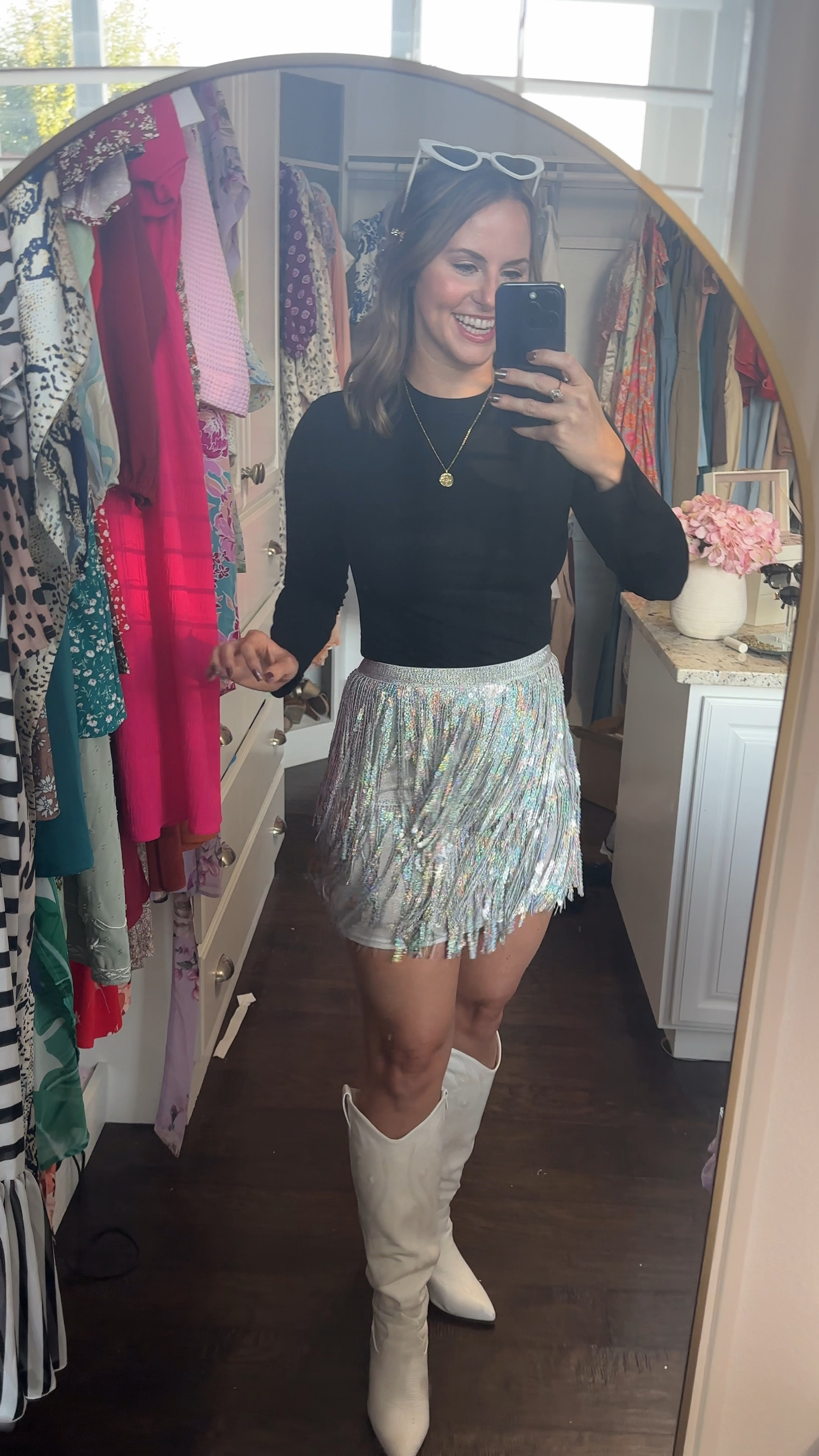 New Year’s party, Fun concert or Vegas outfit! This sequin fringe skirt is SO adorable! It’s stretchy and also has a zipper in the back. It’s high waisted and has elastic waist band. Paired it with this black top that gives the look of a bodysuit, white cowboy boots, heart sunglasses & sparkly hair clips. 

Eras tour outfit, Meghan trainor concert outfit, Taylor swift outfit , Halloween costume, fall outfit, Las Vegas dress , fringe skirt #ltkvideo 

#LTKFindsUnder50 #LTKCyberWeek #LTKParties