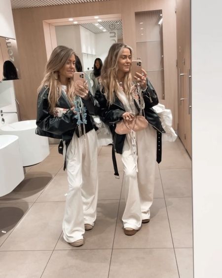 Airport outfits 💕💕 white wide leg comfy long pants (added some different price ranges girls), leather biker jackets a basic cropped white hoodie, baseball cap and fly away in style girls.. cause of the cold adding our fluffy cozy uggies to be honest with you we love to wear all year long xx✈️✈️💕💕 our withe bags and phone jewelry are from our brand @prettypiecesbySiss and shoppable in our online shop www.bySiss.com 
.
Asos, boohoo, spring style, travel looks, travel twins, city style, oversized, bySiss style, streetstyle 

#LTKtravel #LTKstyletip #LTKU