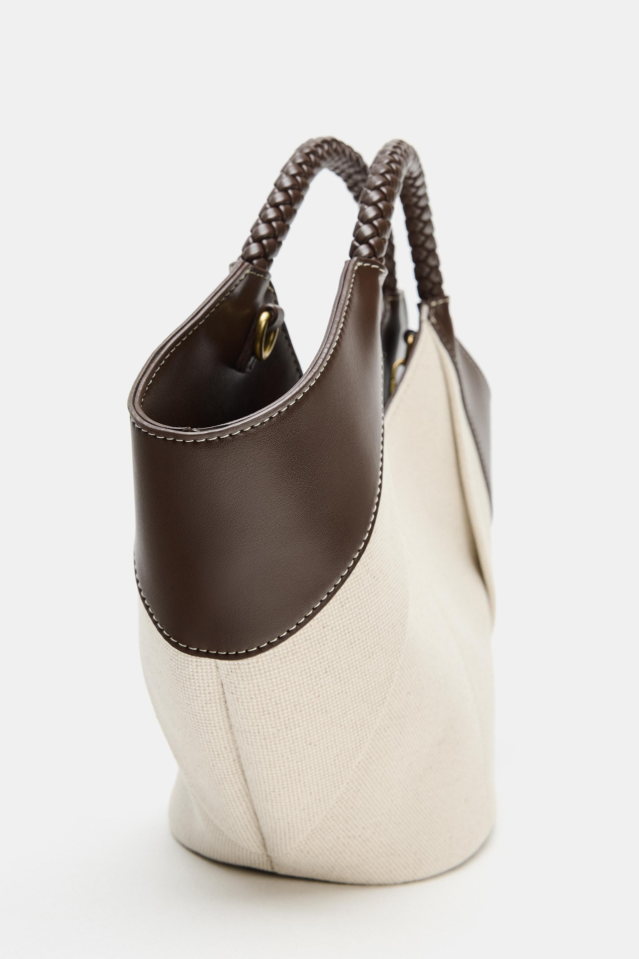 Model height: 173 cmMini tote bag. Contrast topstitching on the body. Double braided top handles ... | Zara DE