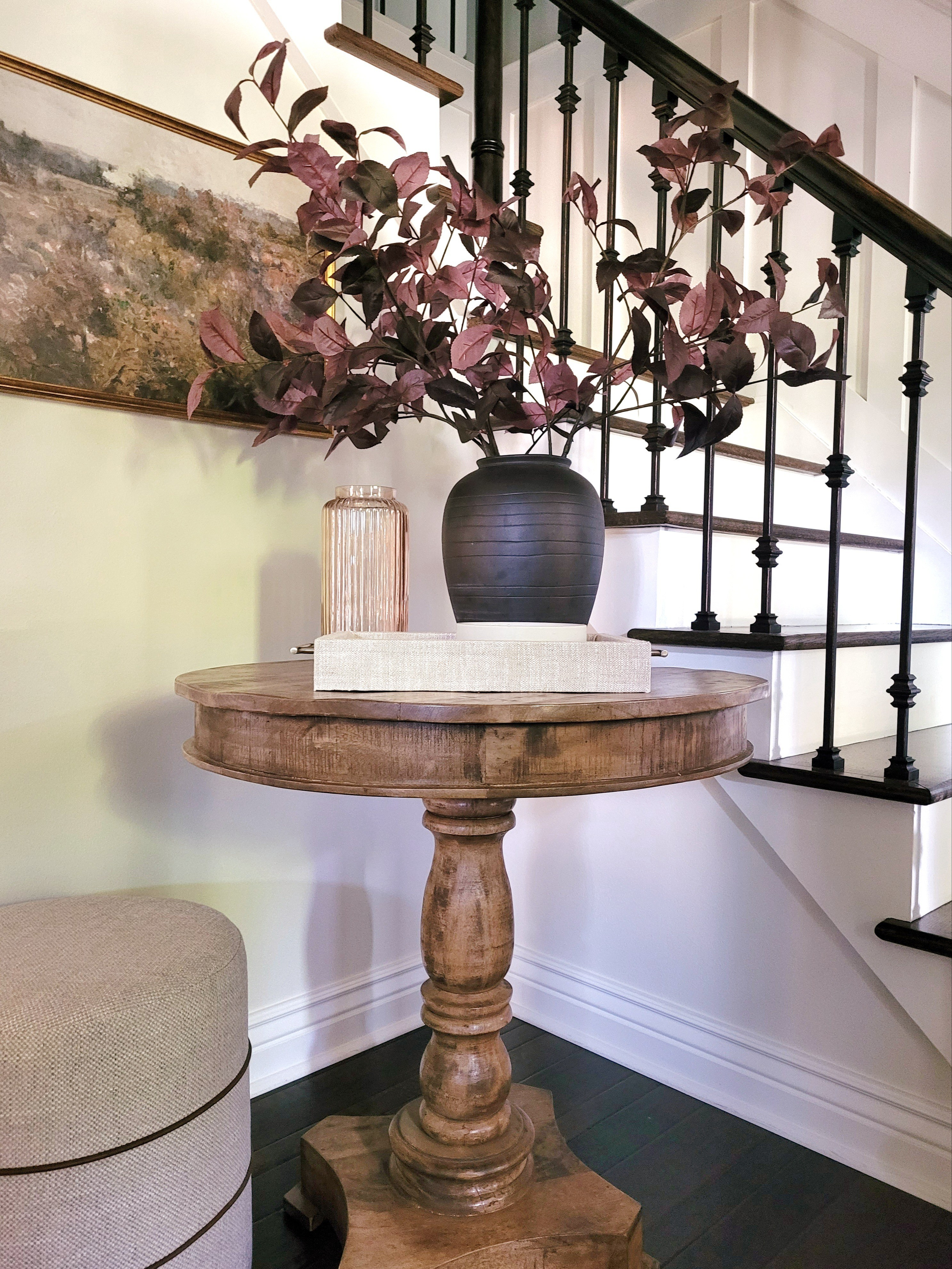 Fall entryway decor with these affordable fall stems,  vintage inspired landscape wall art,  small console table, fluted vase, and round ottoman.

#LTKHome #LTKFindsUnder50