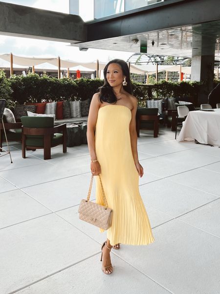 Wedding guest dress perfect for spring and summer. Love the pleated dress and how it actually stays up. Wearing size XXS and it fits true to size. Pairing with nude strap oh heels and statement Kendra Scott earrings  

#LTKSeasonal #LTKwedding #LTKstyletip