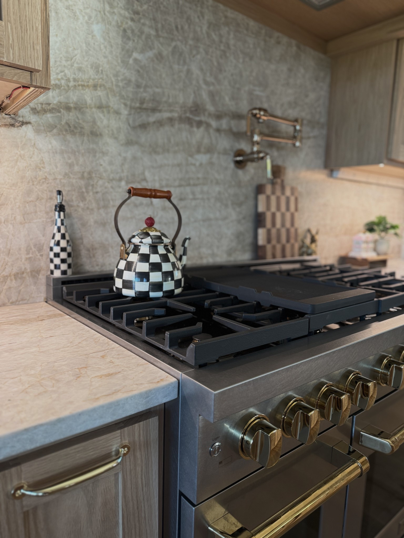 Kitchen decor | Mackenzie childs| zline kitchen and bath | Taj Mahal | neutral kitchen | pot filler | kitchen appliances | cabinet hardware | polished gold | cutting board | 

#LTKHome #LTKvlog #LTKdayinmylife