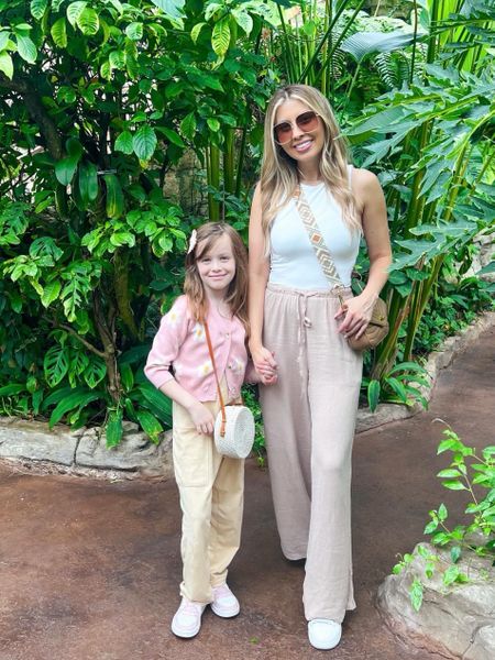 A Butterfly Dream! 🦋 We stepped into the rainforest in our comfiest tourist looks. These wide leg drawstring pants are seriously the best! I added a wider bohemian strap to my every bag to make it more casual but still chic. 

Brynn is wearing a flowy jumpsuit from Amazon and sweater from Shein. 