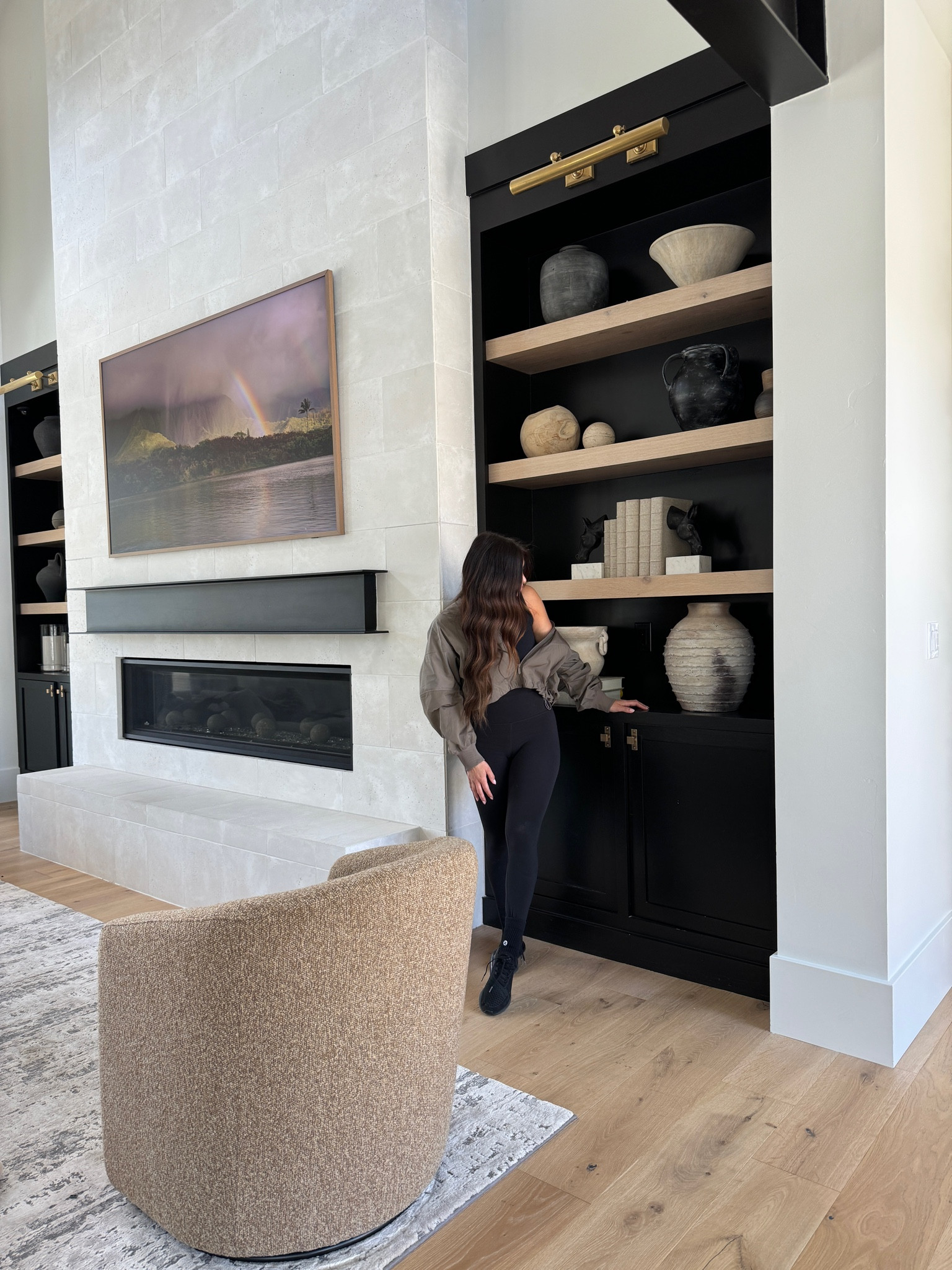 Don’t be afraid to leave your shelves empty as you take time to source the perfect items for your space! I spent over a year curating this collection for our great room.

#LTKhome #LTKstyletip