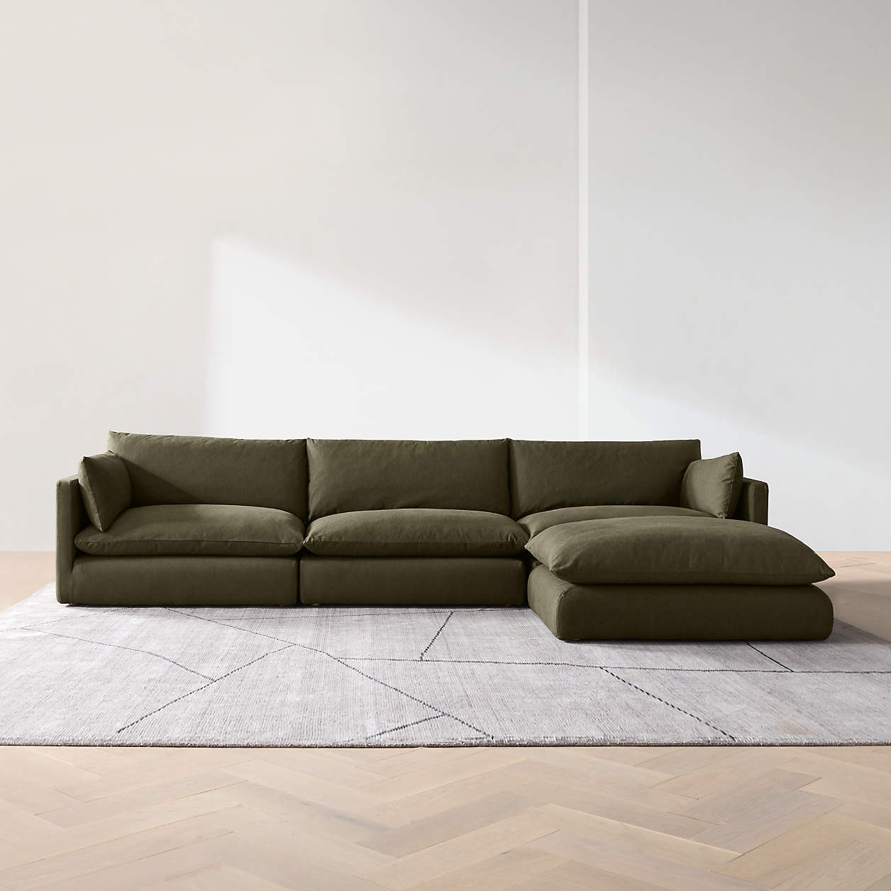 Unwind Modular 4-Piece Slipcovered Reversible Sectional Sofa with Ottoman + Reviews | Crate & Bar... | Crate & Barrel