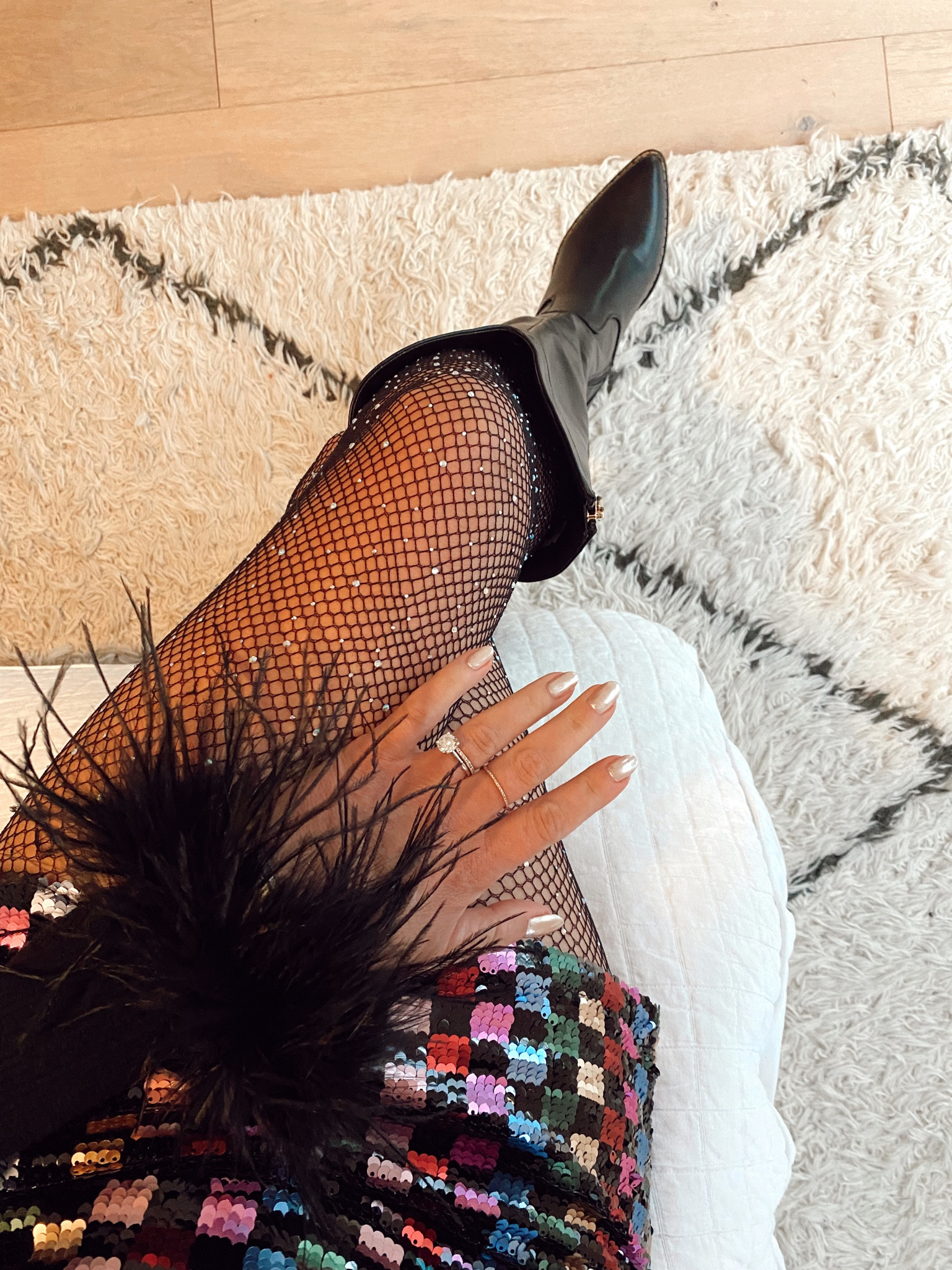 All the sparkles for nye with a sequin mini skirt, sequin fishnet tights and a feather trimmed top  

#LTKunder50 #LTKSeasonal #LTKHoliday