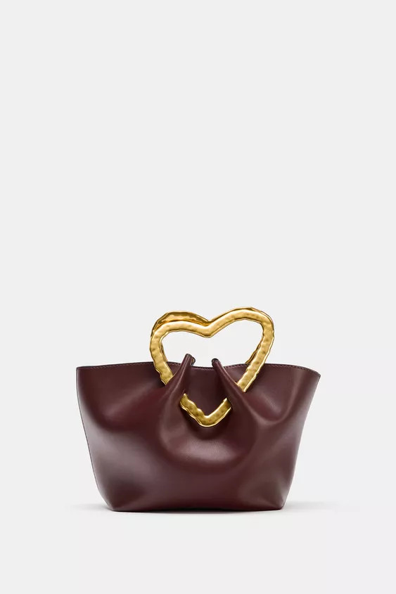Sack-shaped handbag. Heart-shaped metal top handle. Removable interior compartment. Metal snap bu... | Zara US