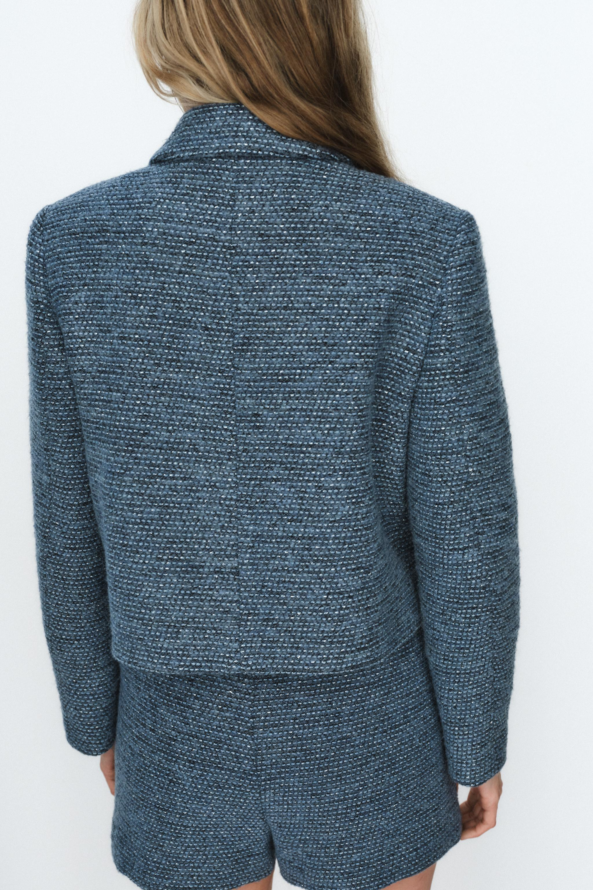 Bouclé jacket with a lapel collar and long sleeves with shoulder pads. Front patch pockets with ... | Zara UK