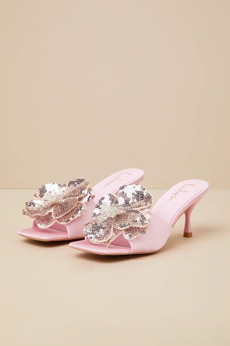Be pretty in pink! The Lumena Baby Pink Satin Flower High Heel Slide Sandals are under $40.

Keywords: Holiday outfit, holiday dress, pumps, heels, ankle strap heels, pink sandals, cocktail party

#LTKHoliday #LTKSaleAlert #LTKFindsUnder50