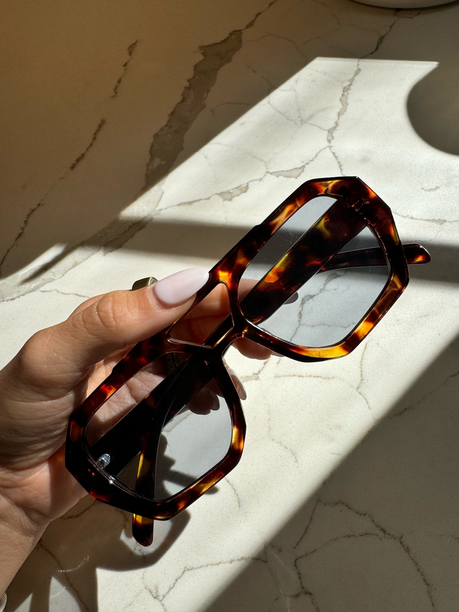 Tortoise frame sunglasses with blue frames 