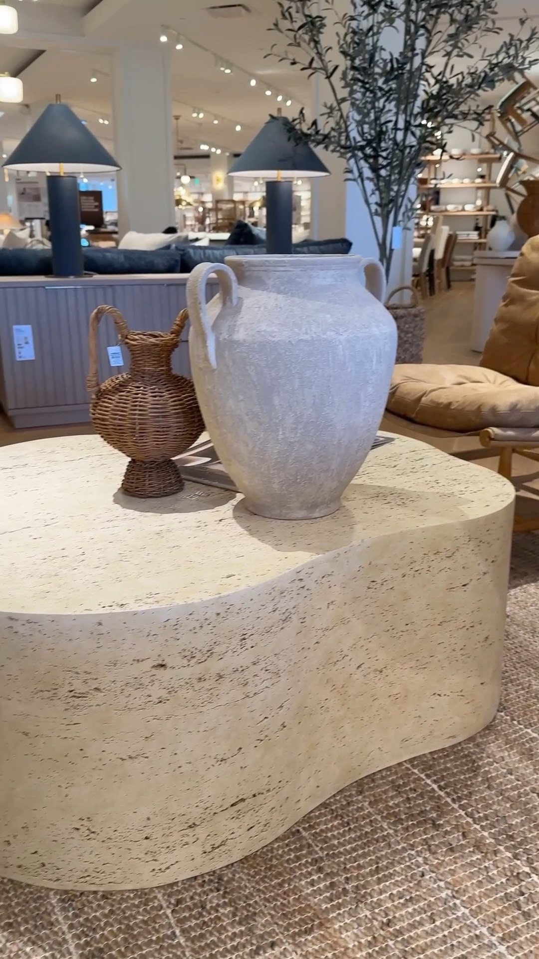 Modern organic living room moment! 🤎 The Fleur Faux Travertine Resin 52” Coffee Table brings sculptural curves and a beautiful stone-inspired finish to the center of the space. ☺️ Designed to mimic the look of natural travertine, each table has its own subtle veining and texture, making every piece feel unique. 🫶🏻 A striking coffee table that instantly elevates a living room with warm, organic texture. Linked this piece and similar styles to shop! 💫 #CrateAndBarrel #CoffeeTable
#LivingRoomInspo

#LTKSaleAlert #LTKHome