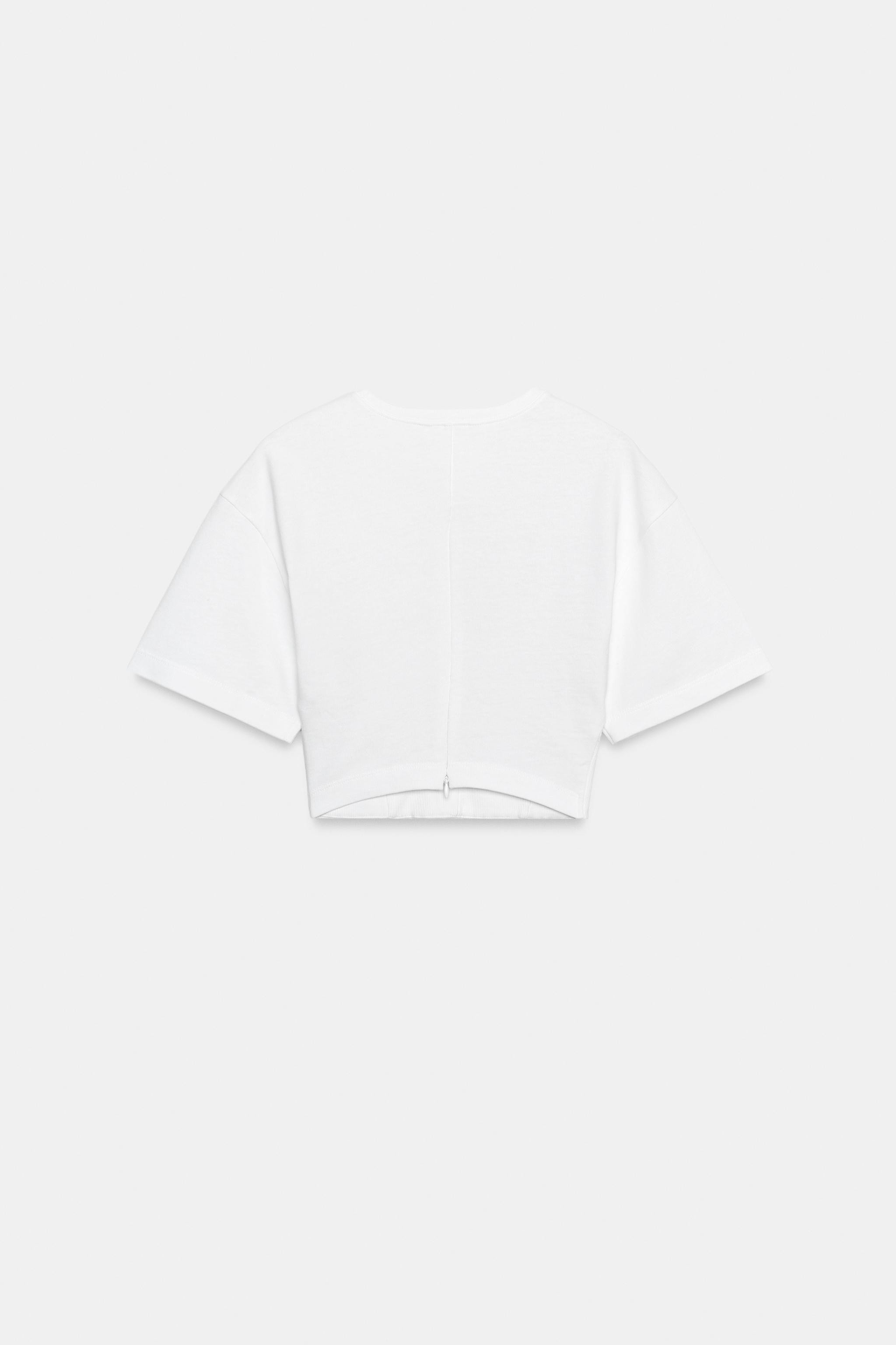 SLIM FIT - ROUND NECK - CROPPED - SHORT SLEEVEBustier-style T-shirt made from a cotton blend yarn... | Zara US